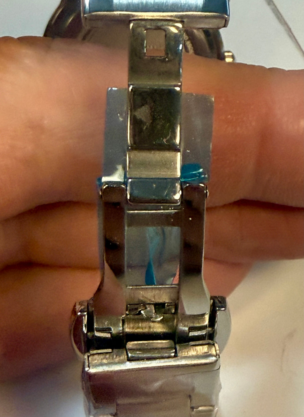 Close-up of a Invicta Ladies Celestial I  band on a wrist with a blurred background