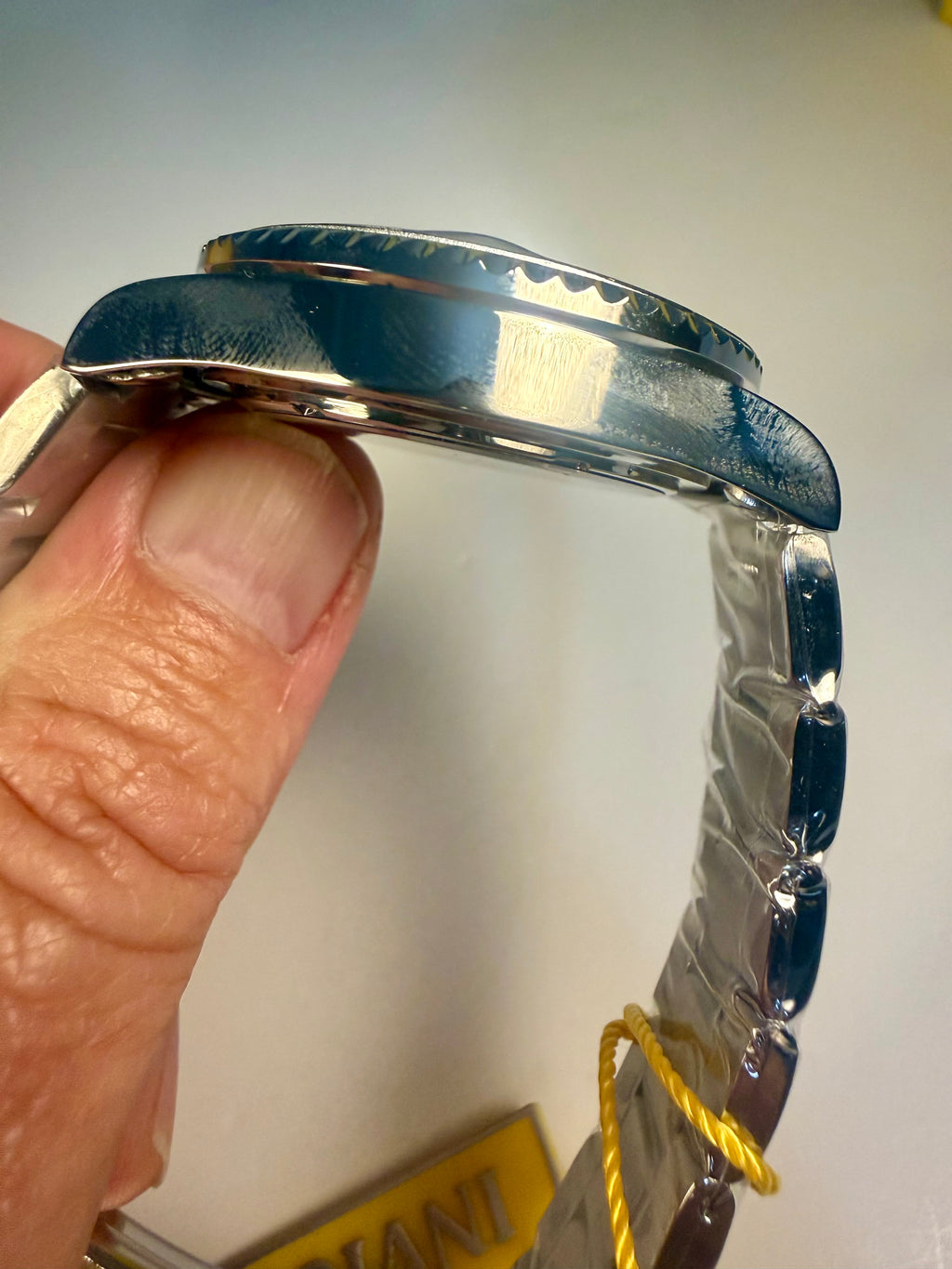 Close-up of an Invicta Specialty Rowan  watch band held by a hand with a white background