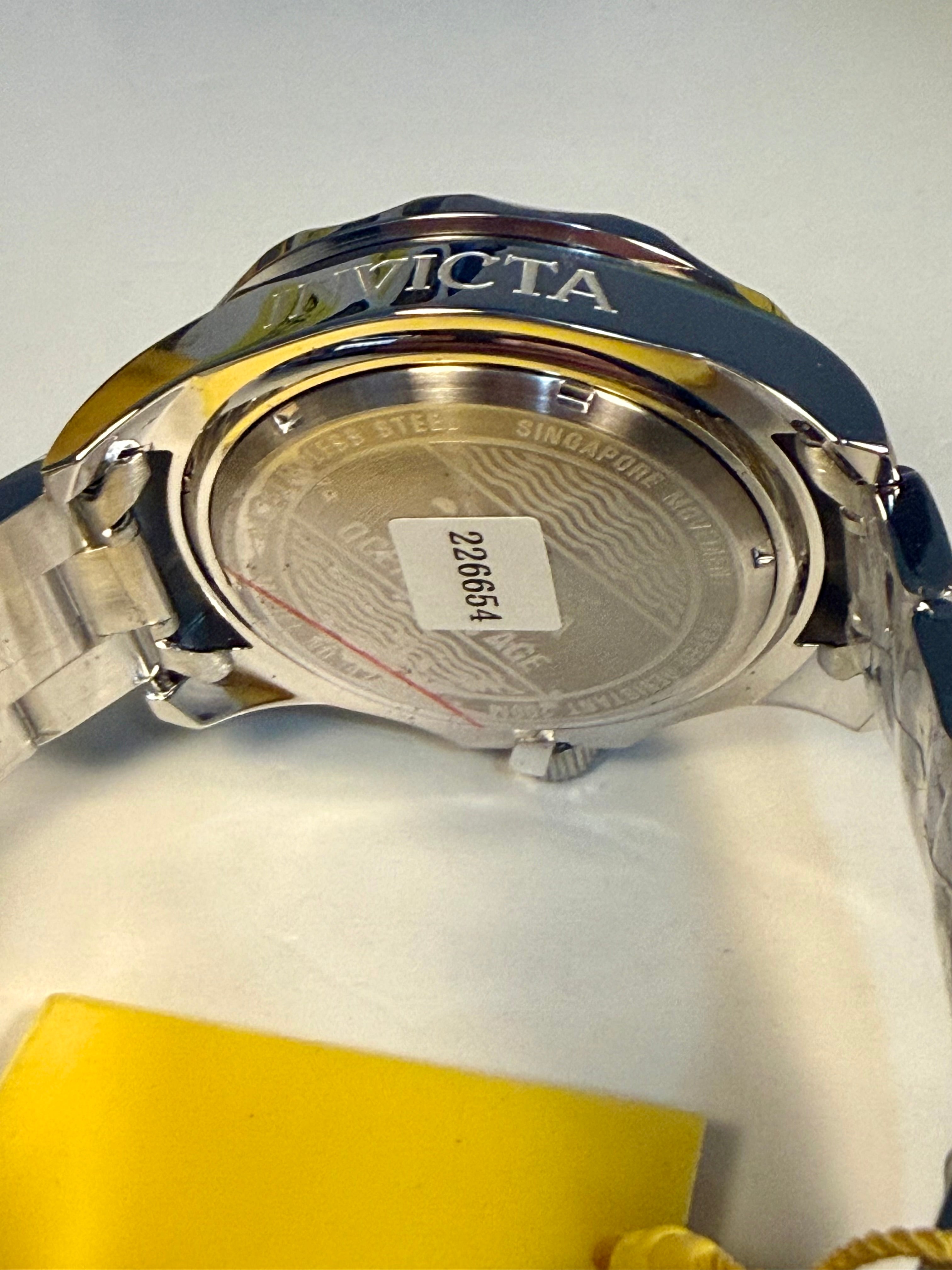 Invicta  Back view of a watch with 'randing on a white background