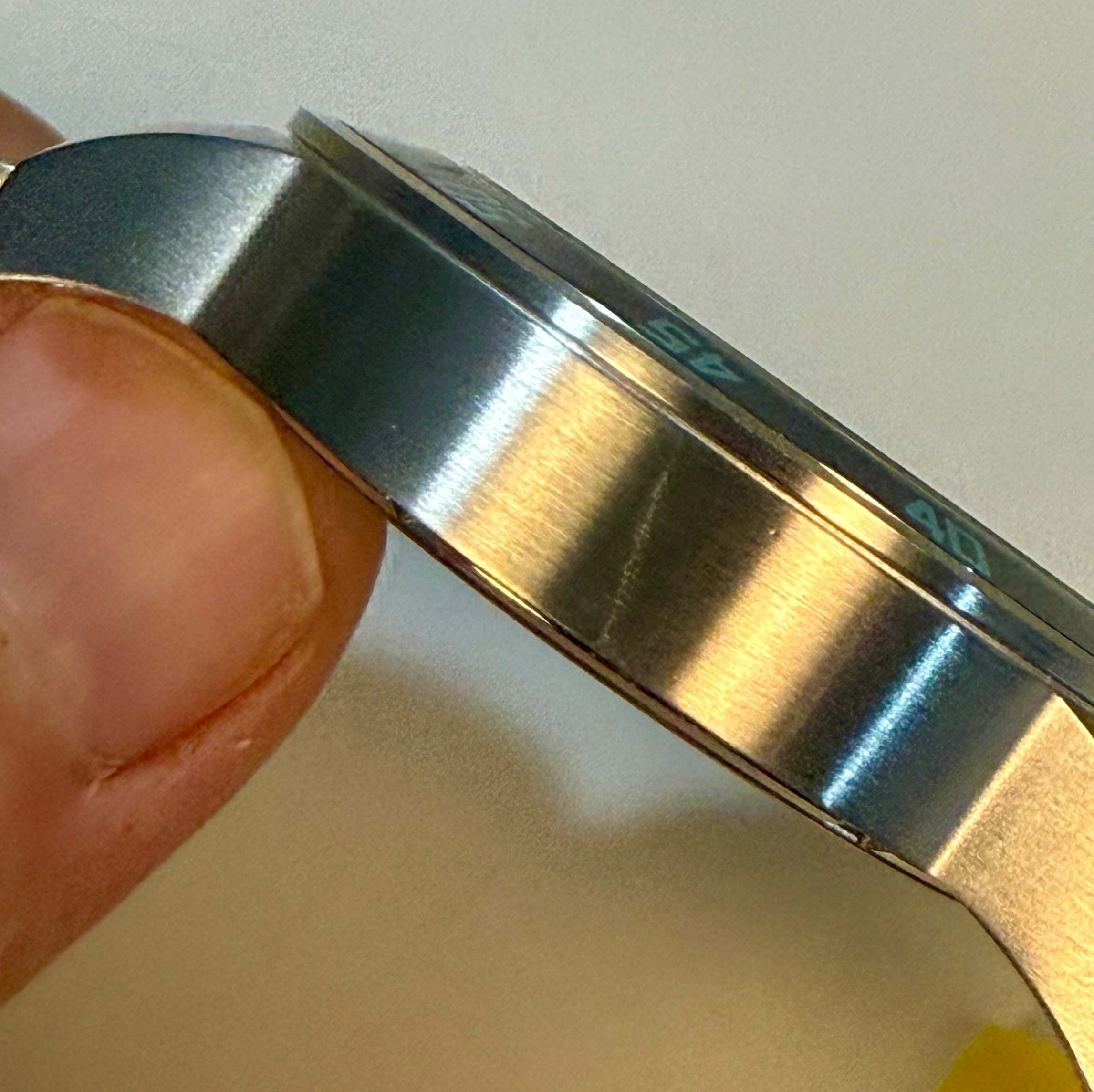 Close-up of a Invicta Specialty Gramercy 45mm Mensengraving, held by a hand.
