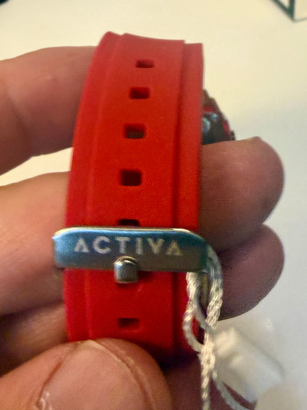Activa X Ranger Bundle wristwatch with 'Activa' brand name held in a hand against a white background
