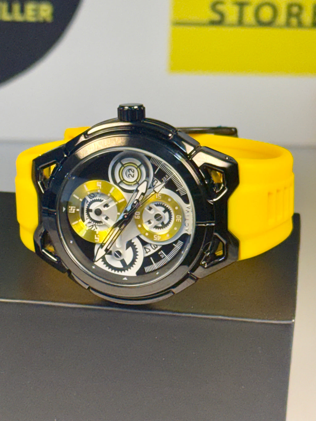 Activa ACW9549-006 Electric Yellow Skeleton Dial 44mm Black Silicone Sport NIB Watch with yellow strap and black case on a gray surface