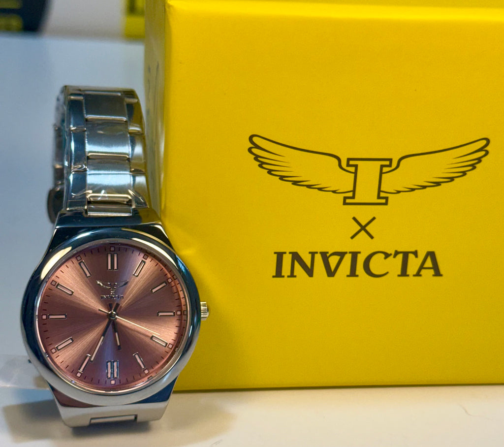 Invicta Ladies Celestial I Silver watch with a rose gold face on a yellow Invicta box
