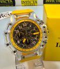 Invicta Racing Vaulthan 44mm watch with yellow accents on a stand, with Invicta box in the background.