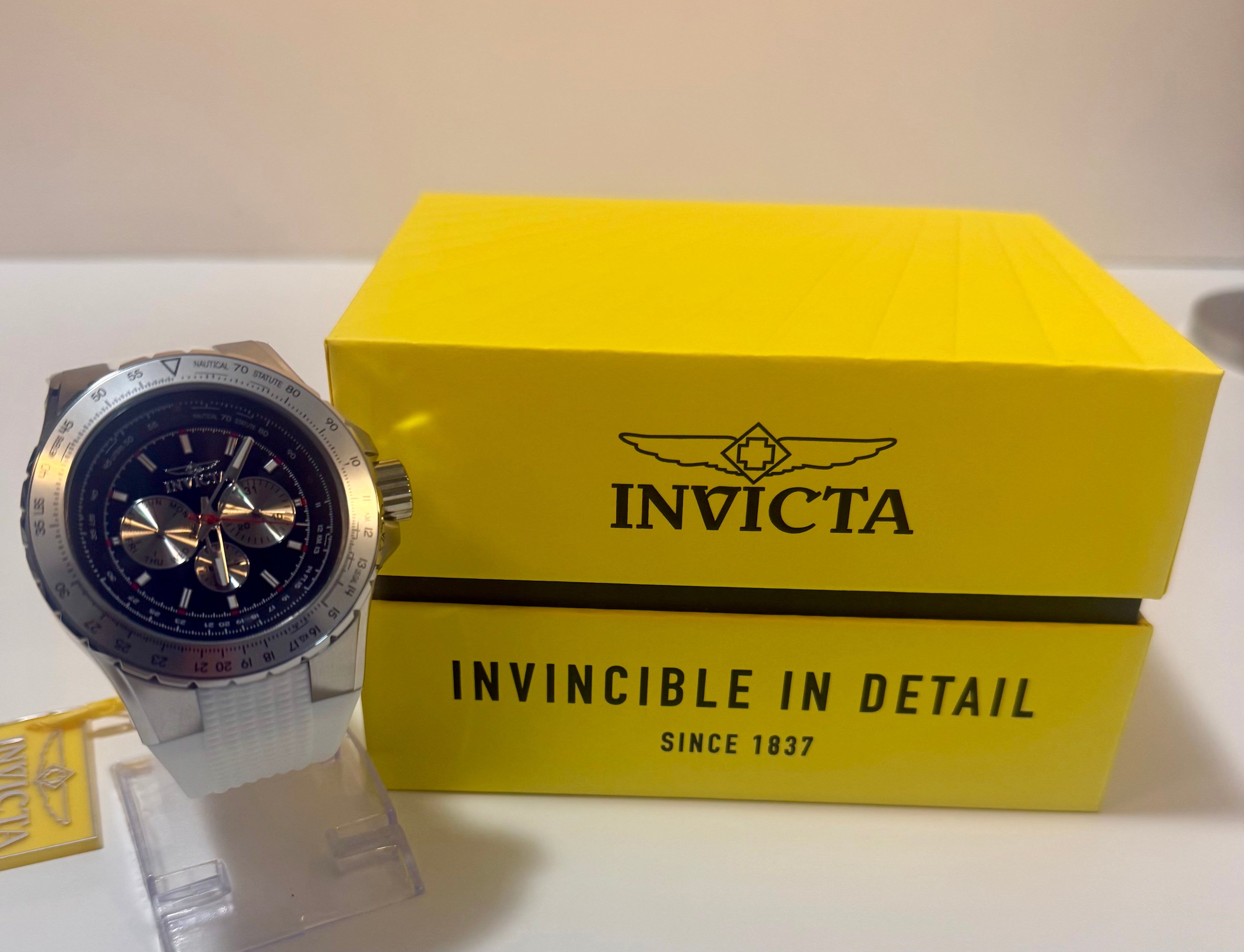 Invicta Aviator  Mens White Silicone Chronograph 50mm with yellow box on a white background