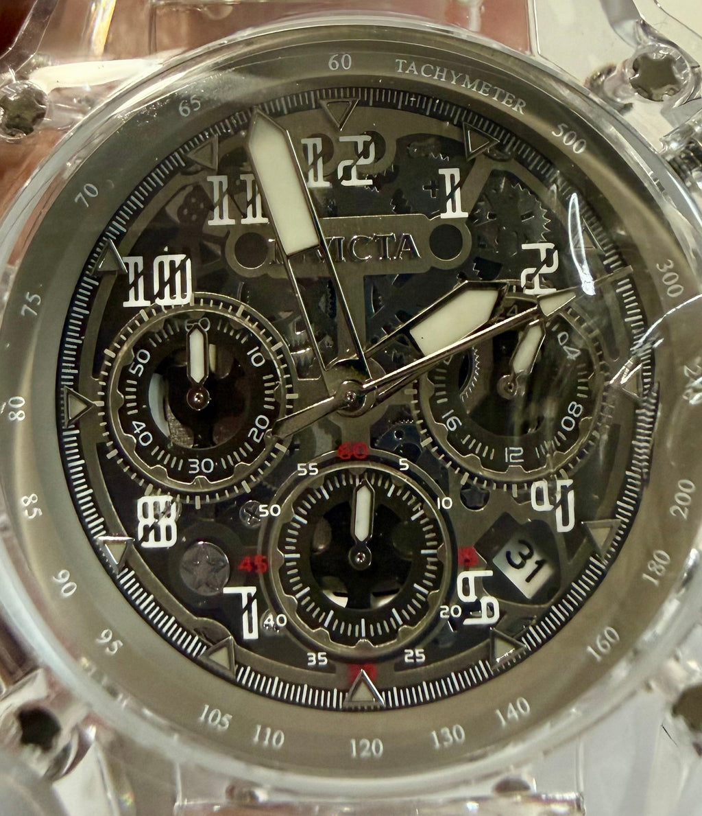 Mens Invicta Racing Vaulthan 44mm Transparent wristwatch with detailed mechanism held by a hand