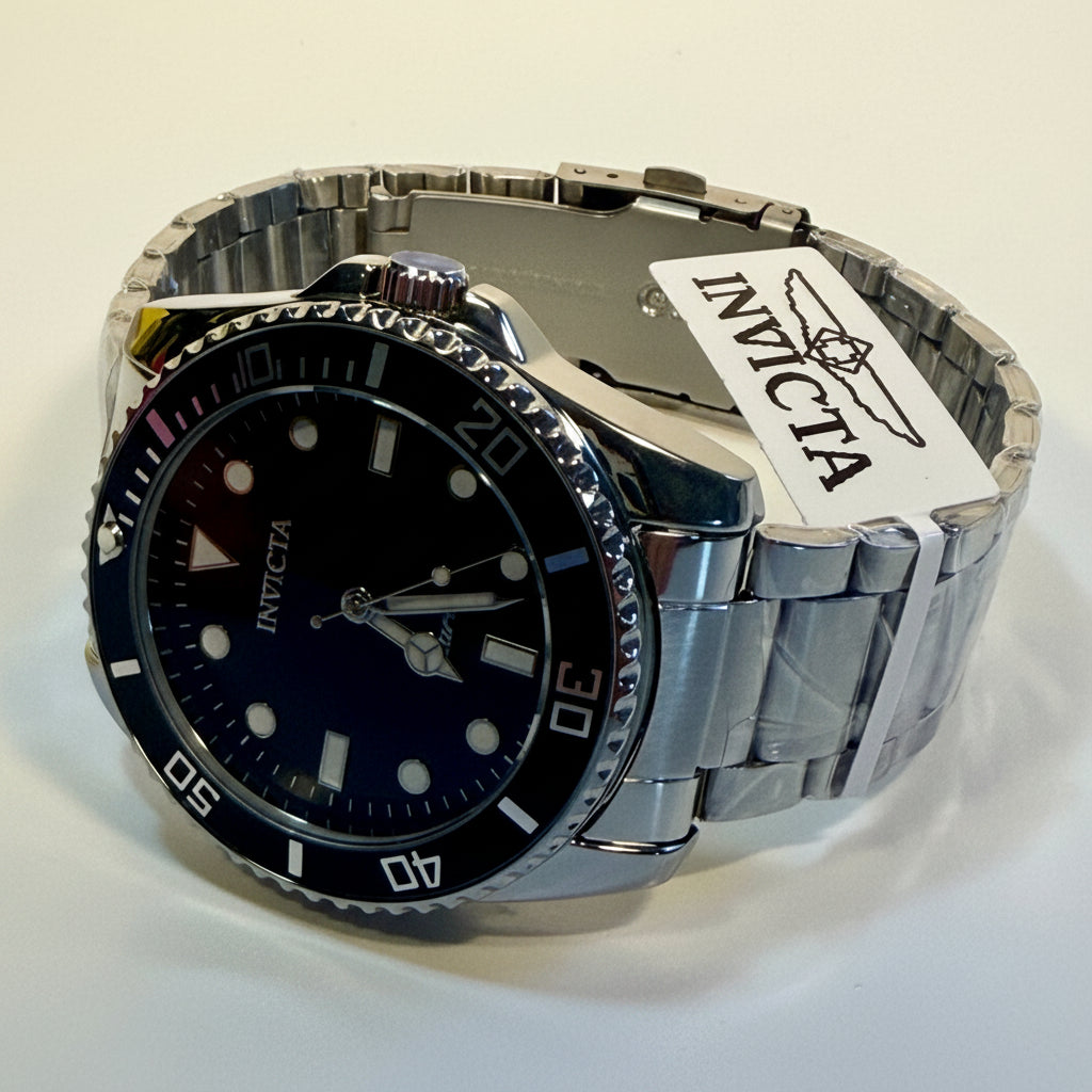 69401 Invicta Mens Pro Diver Vitreos Stainless Steel Bracelet Black Dial 42mm lying on a flat surface