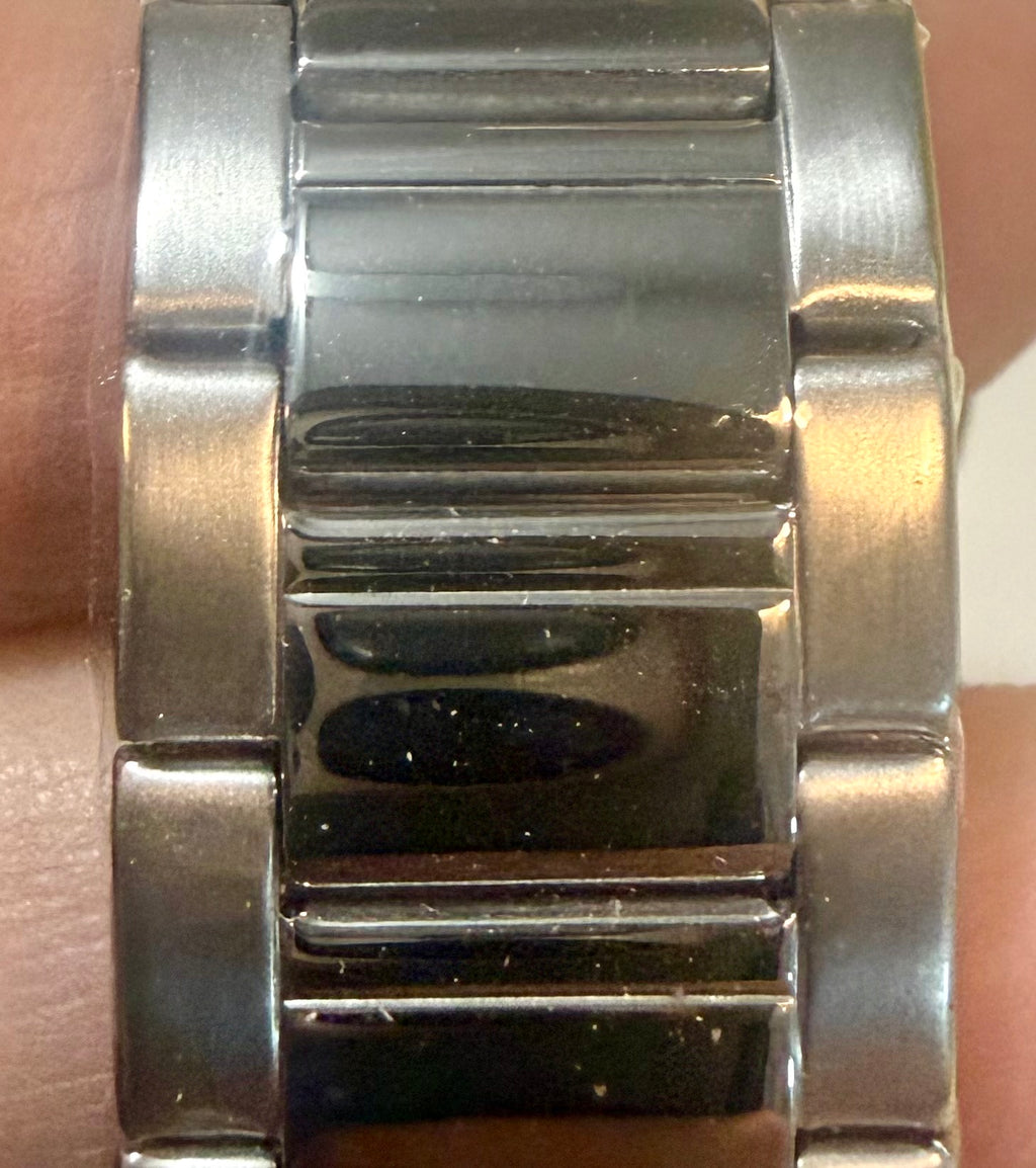 Close-up of a Invicta Speedway 42mm Mens Watch band on a wrist