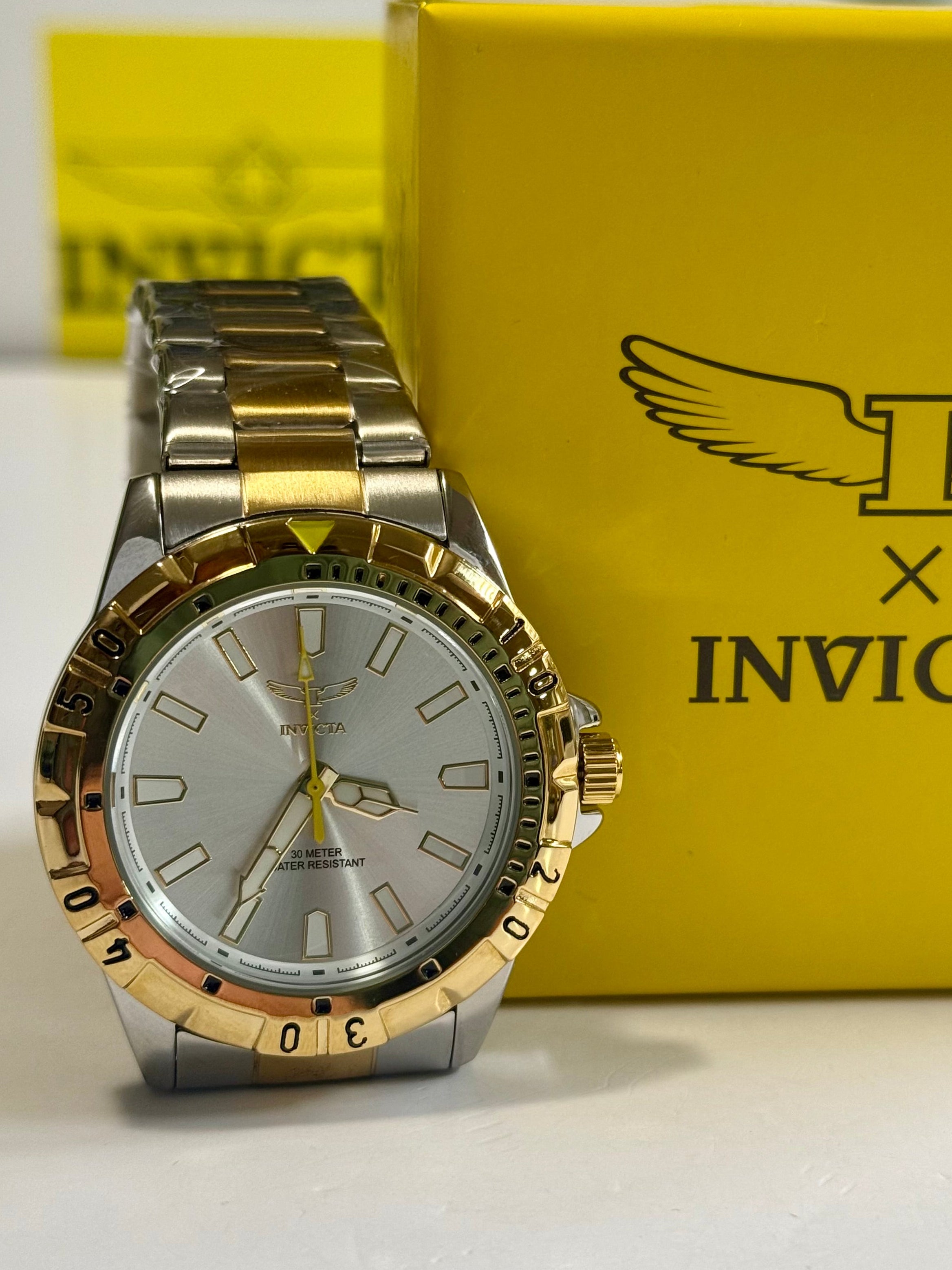 Invicta Specialty I Mens 42mm Gold and silver watch in front of an Invicta box
