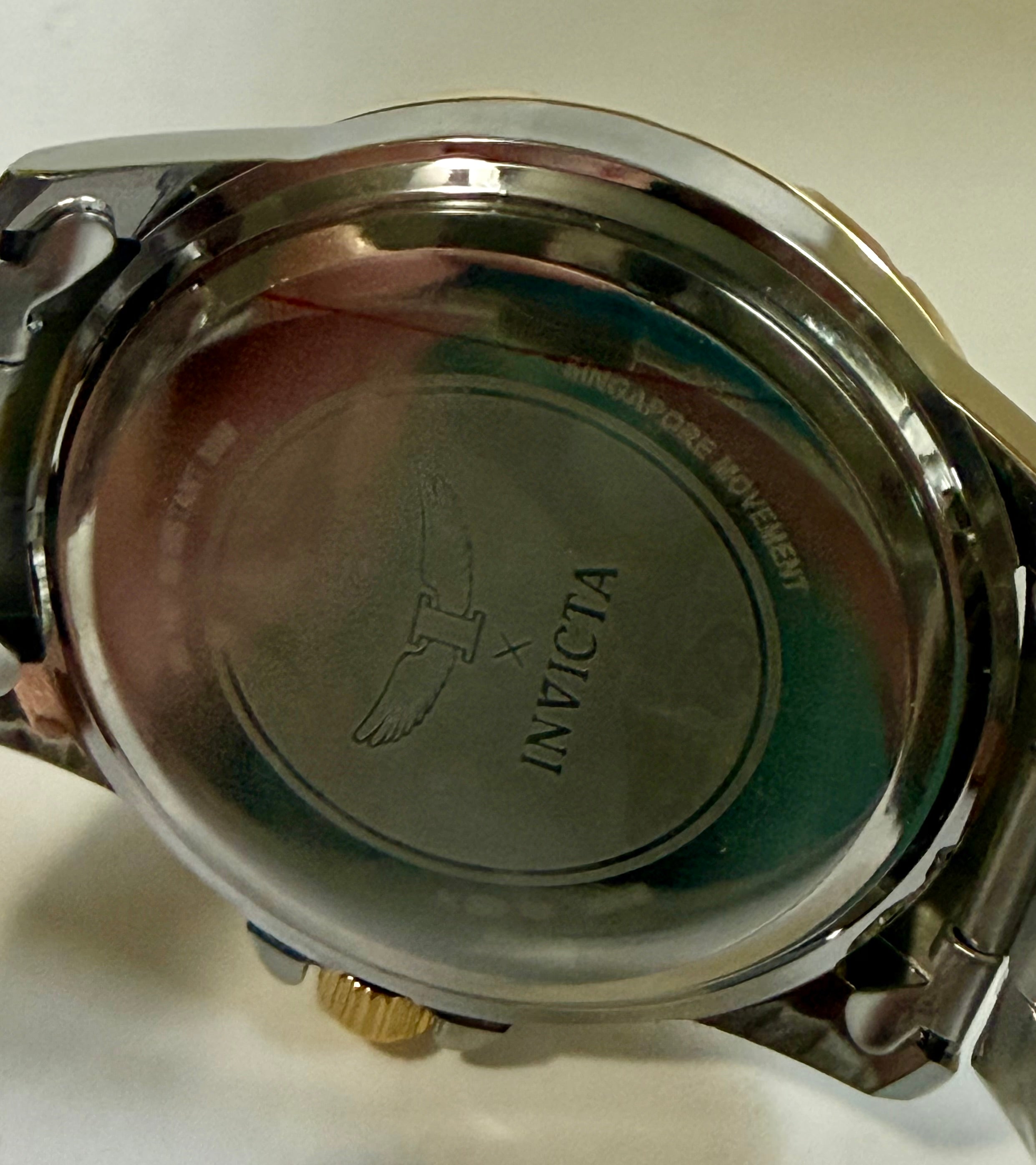 Back view of a Invicta Specialty I Mens 42mm silver Invicta watch case on a white background