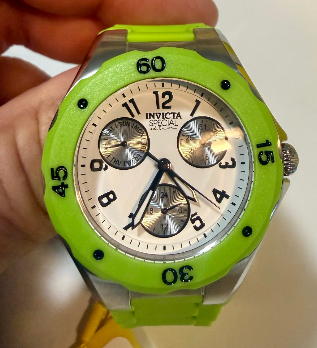 Green Invicta Unisex 38mm Angel watch with detailed face held by a hand
