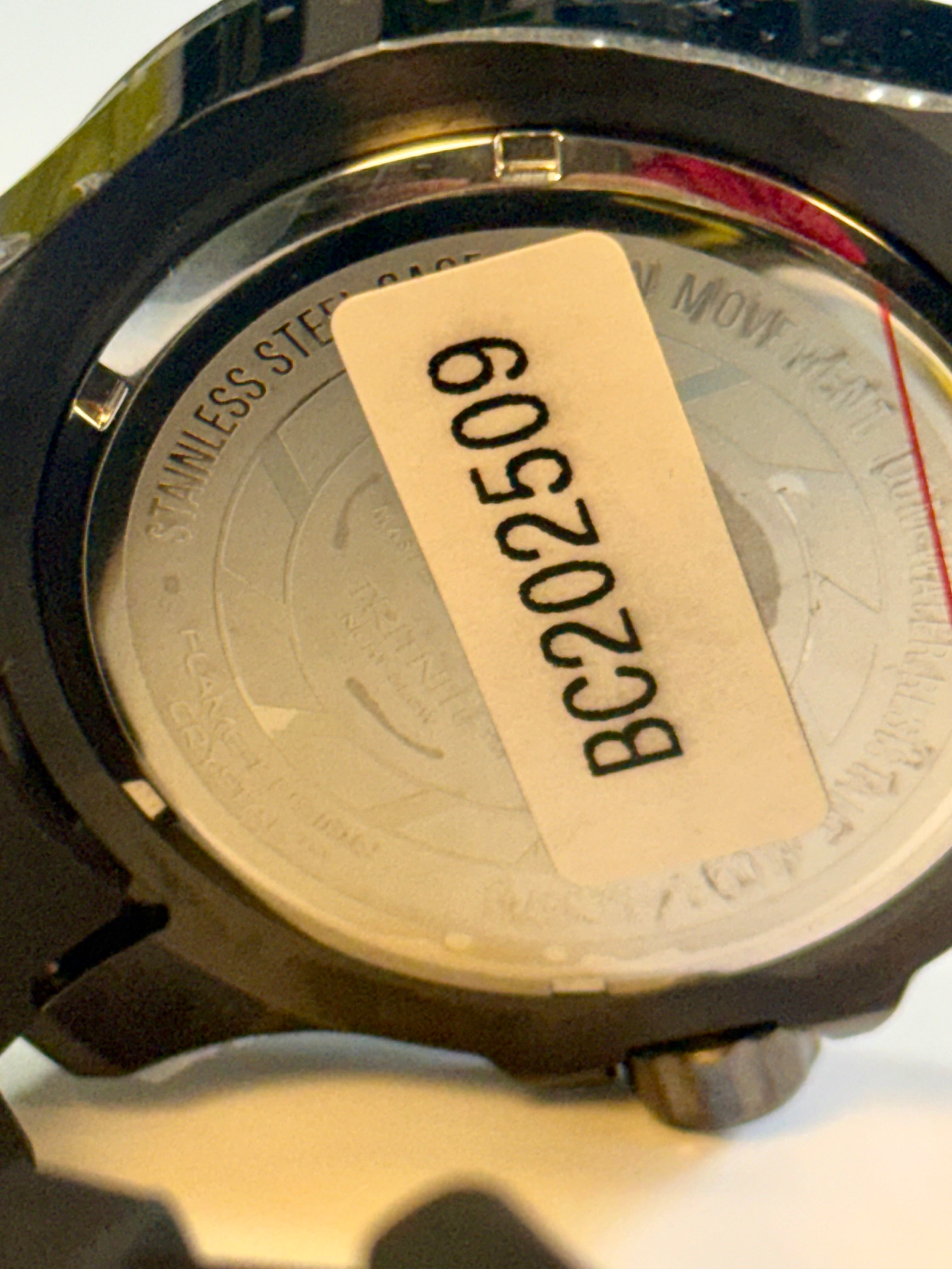 Back of a Invicta Mens Pro Dvider Chronographwatch with a visible serial number label