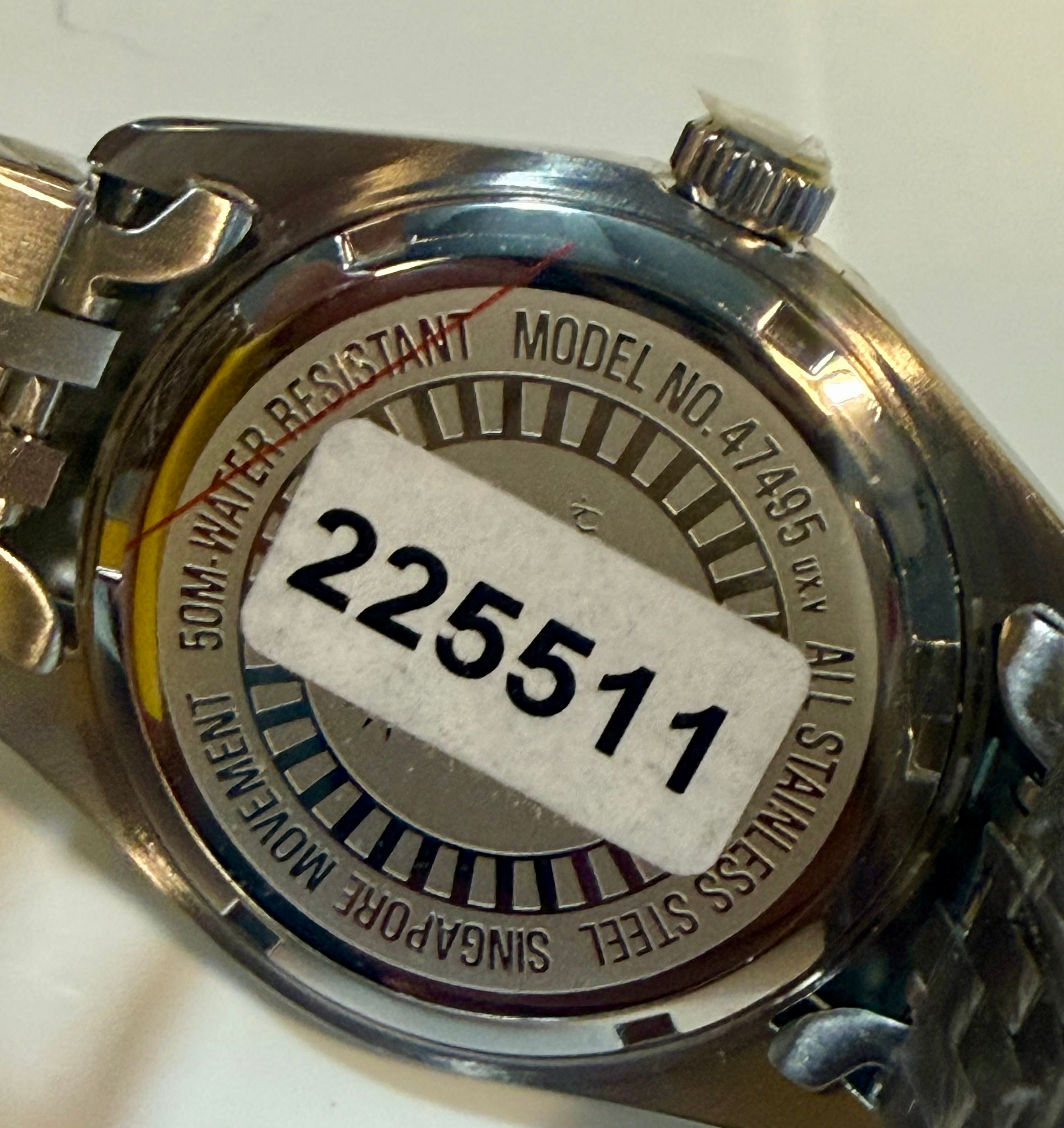 Close-up of a Invicta Ladies Specialty 36mm  watch case with model number 225511 on a white background