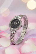 Invicta Ladies Wildflower 30mm Decorative watch with a silver band and black face on a white background