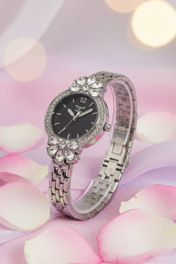 Invicta Ladies Wildflower 30mm Decorative watch with a silver band and black face on a white background