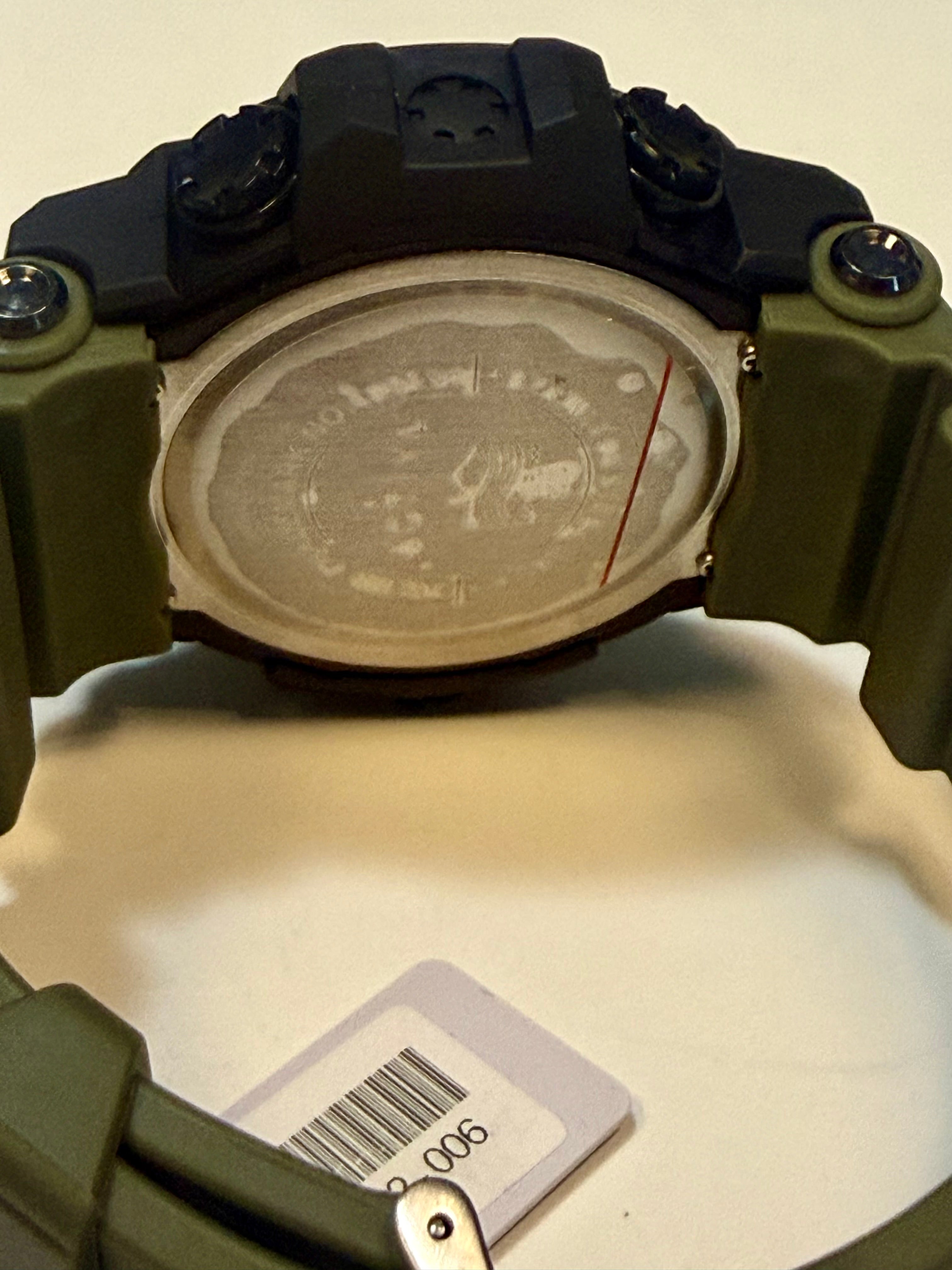 Close-up of a Activa X by Invicta with a visible brand label on a beige background