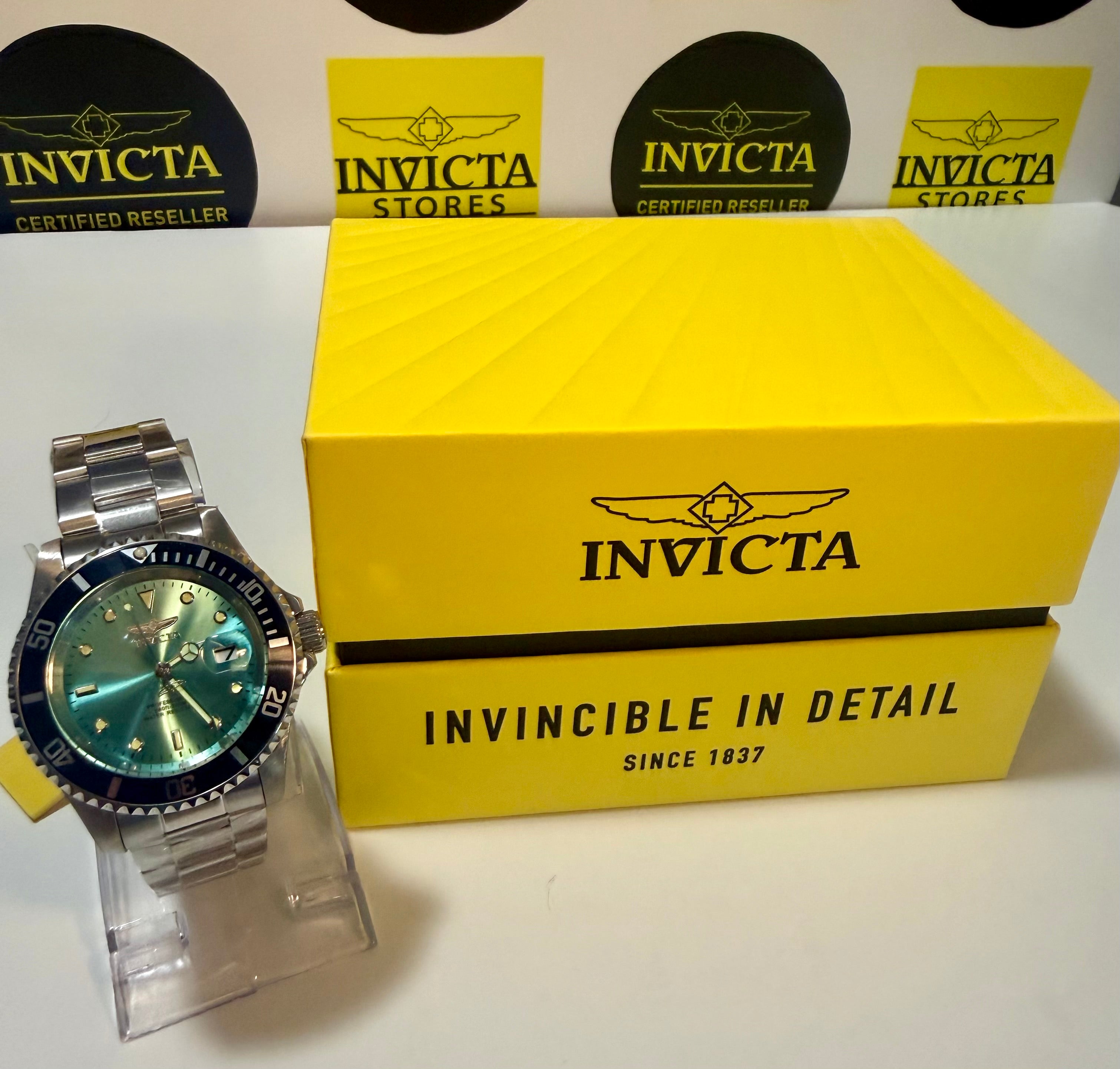 Invicta Pro Diver 47356 Men 40mm Quartz Turquoise Blue Dial Steel Sport Watchwith a yellow box on a white background