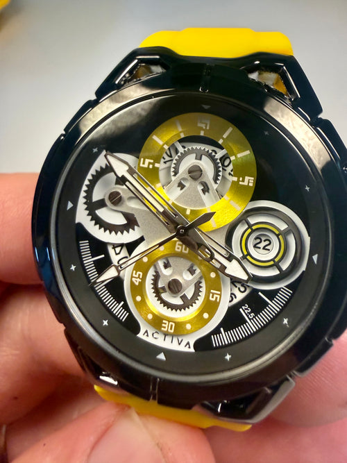 Activa ACW9549-006 Electric Yellow Skeleton Dial 44mm Black Silicone Sport NIB Watch with yellow strap and black face held in hand