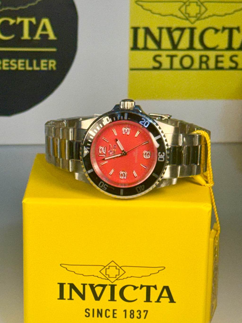 Invicta Specialty Rowan 49350 Men's Watch 40mm Steel Case Rowan Red Dial New watch with red face and silver case on a yellow box with Invicta branding.