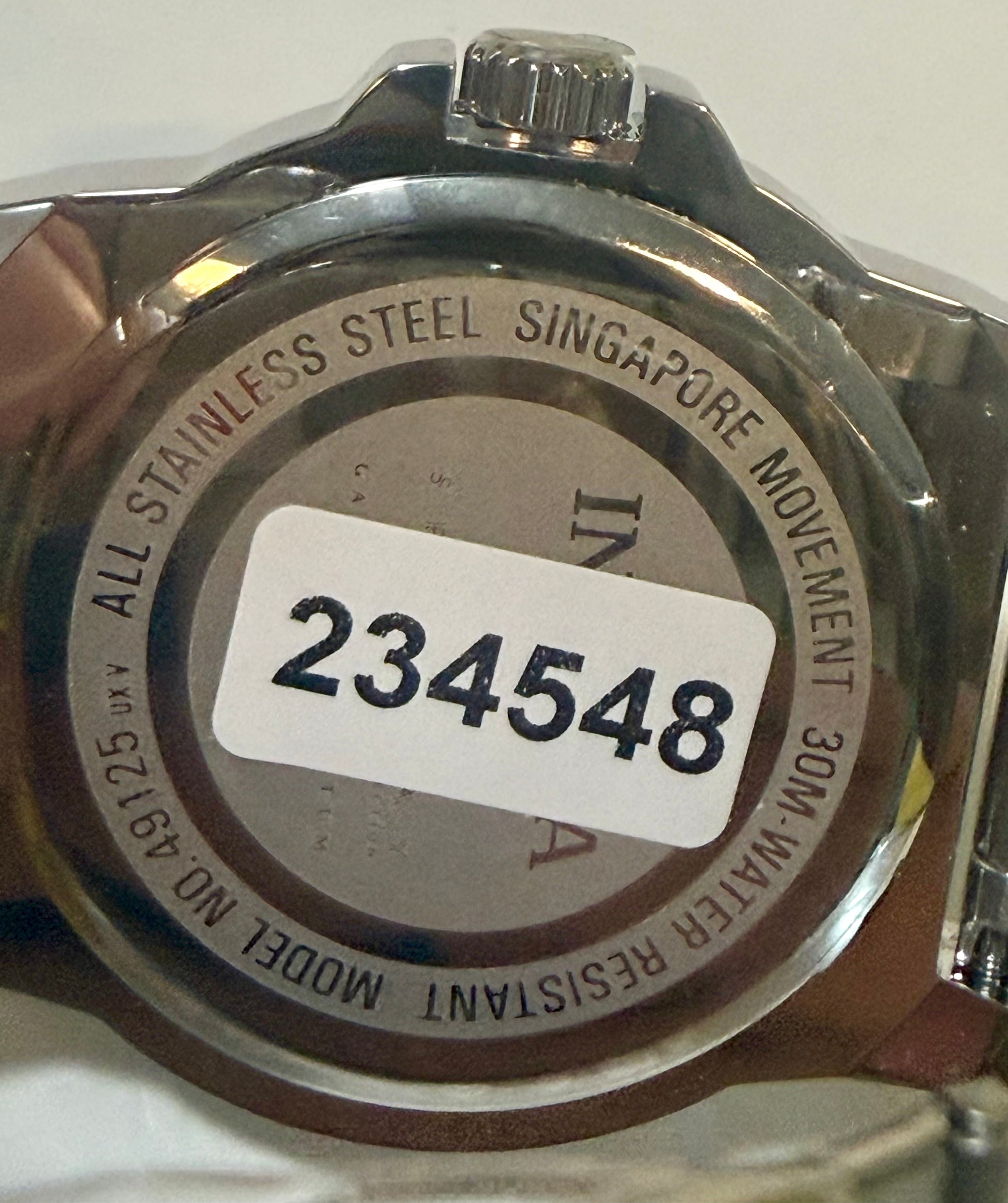Back of a Invicta Speedway 42mm Mens Watch with engraving and a visible model number.