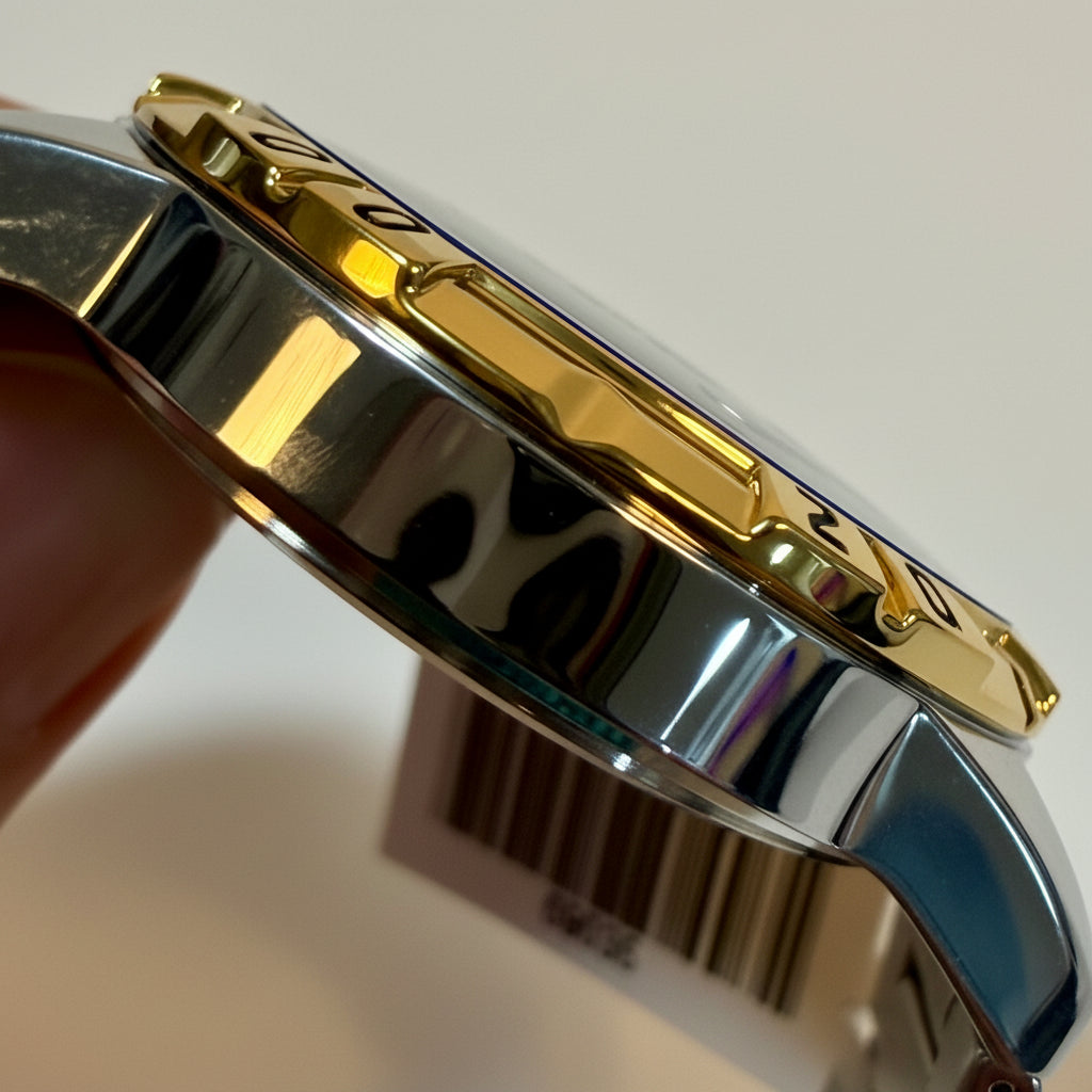 Close-up of a Invicta 69036 Specialty I Men 42mm Two Tone Silver Dial Quartz Bracelet Watchwith gold and silver finish
