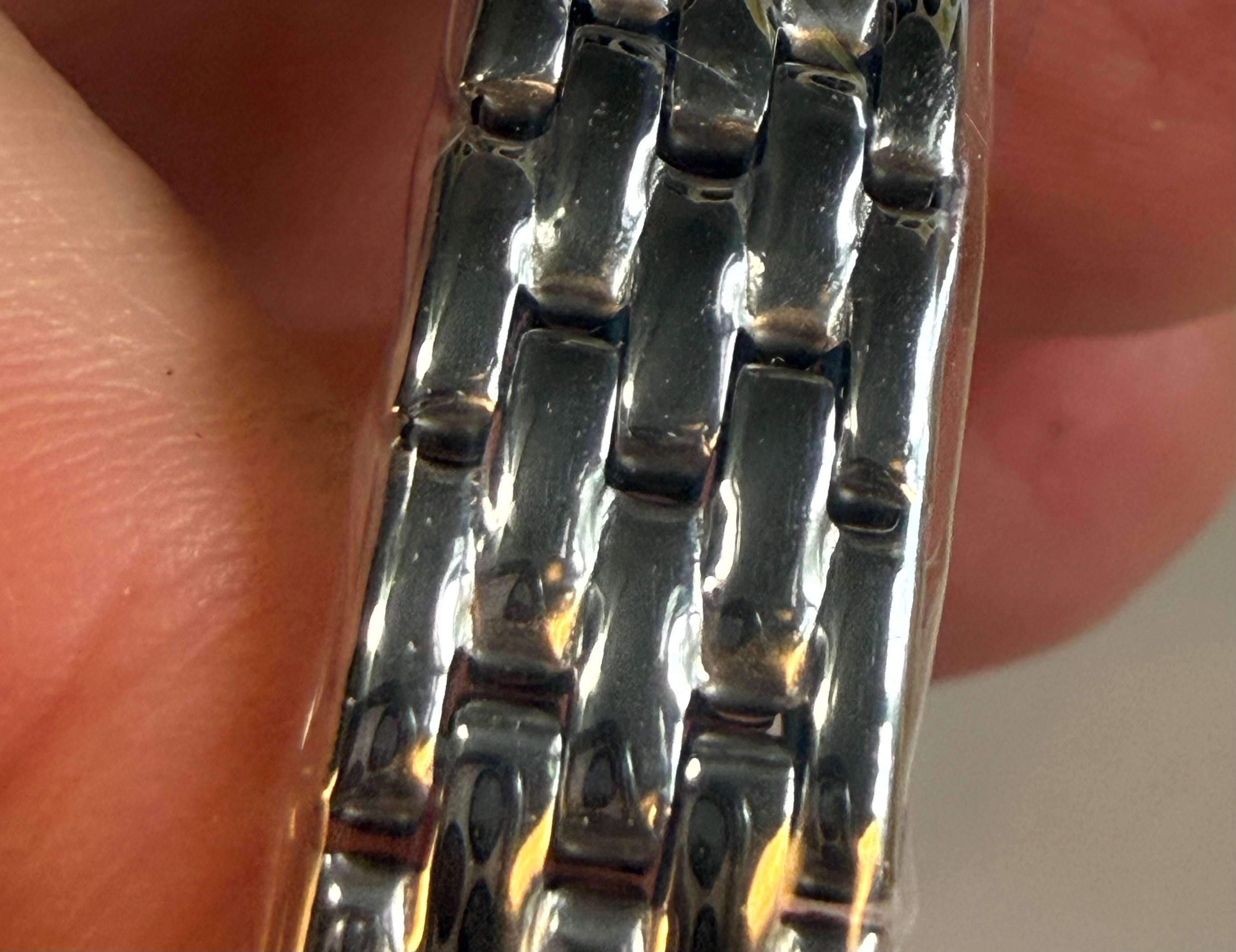 Close-up of a silverInvicta Ladies Wildflower 30mm on a person's wrist