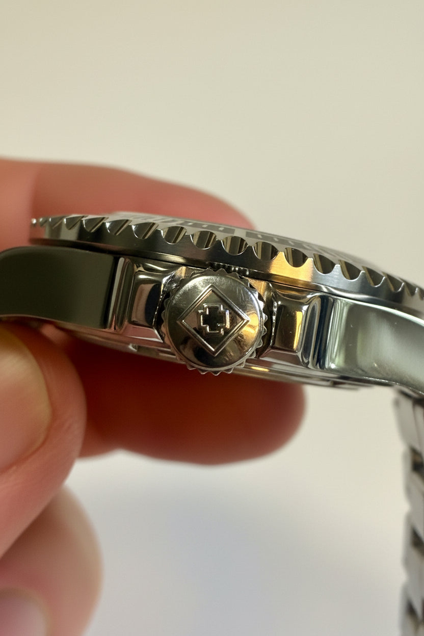Close-up of aInvicta Mens Pro Diver 43mm Heritage  band with a clasp on a light background