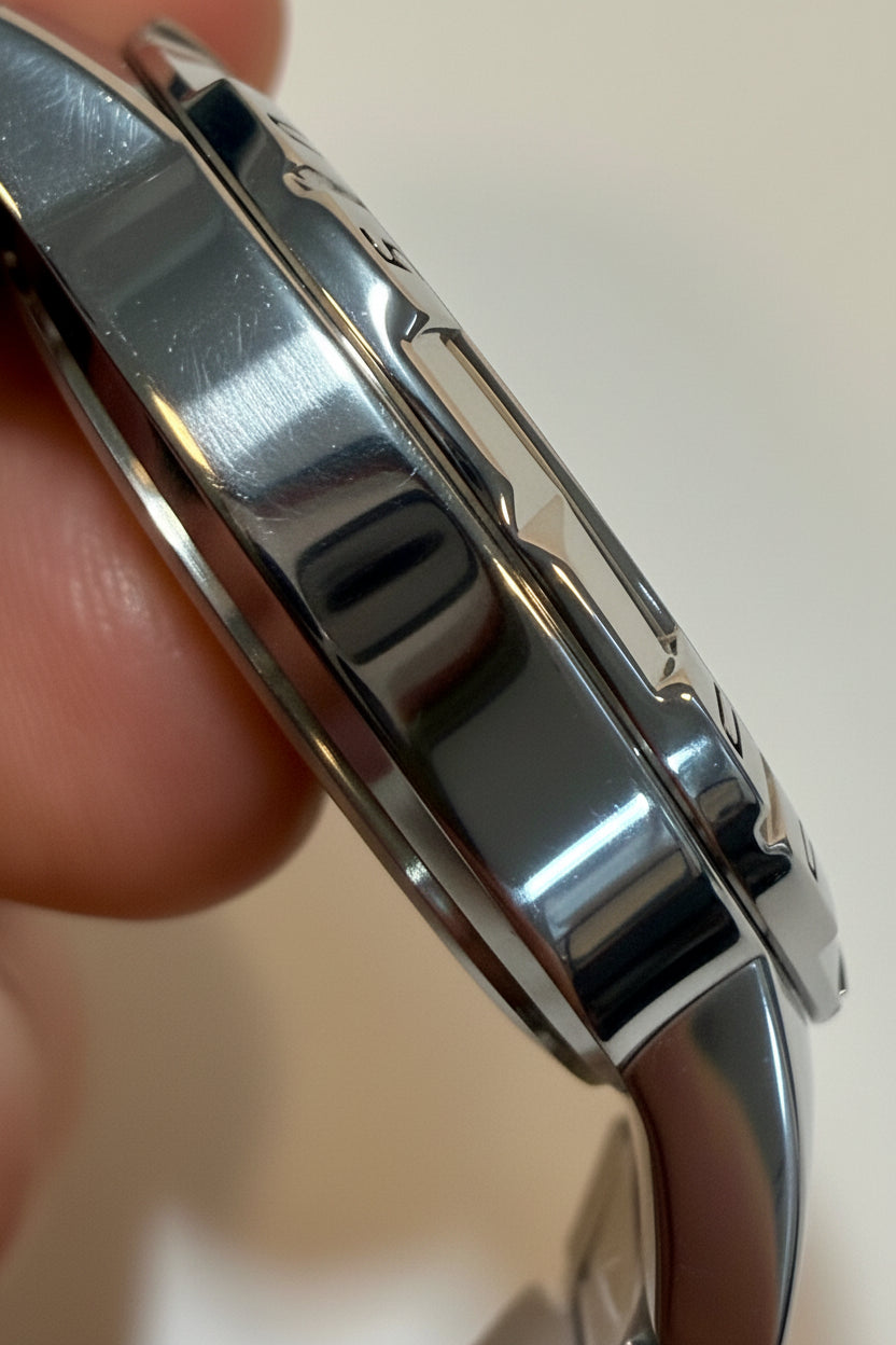 Close-up of a Invicta Specialty I by Invicta Men's Watch - 42mm, Steel (70051) held by a hand against a neutral background