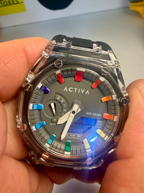Activa Kaleido Rainbow wristwatch with colorful buttons held in a hand, brand 'Activa' visible