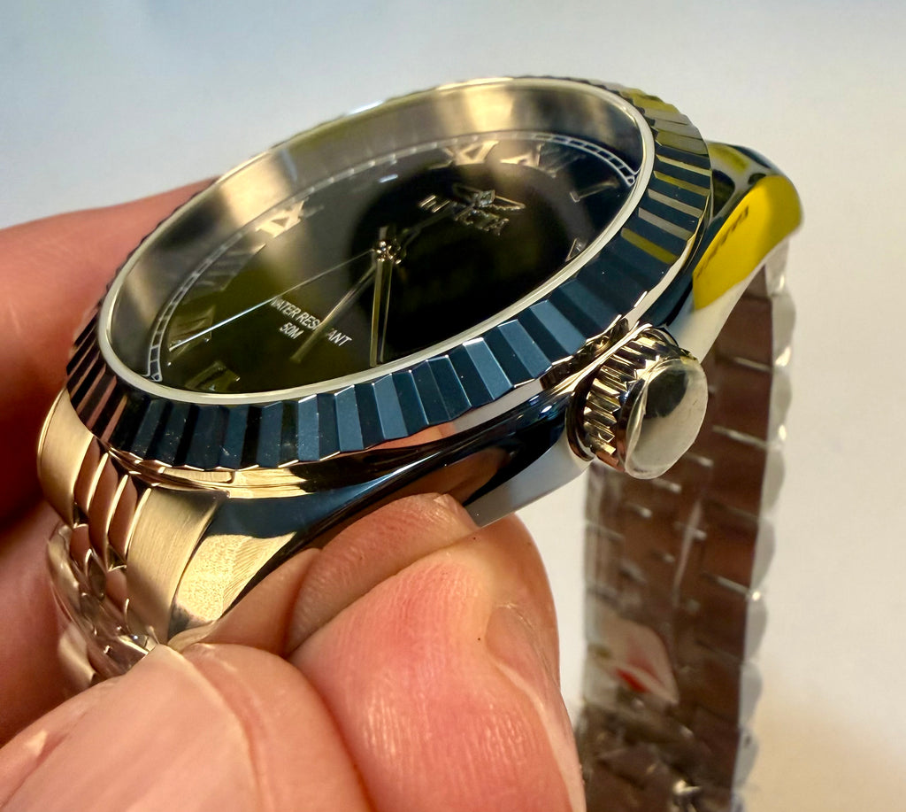 Mens Specialty Rowan 43mm  watch held in a hand with a blurred background