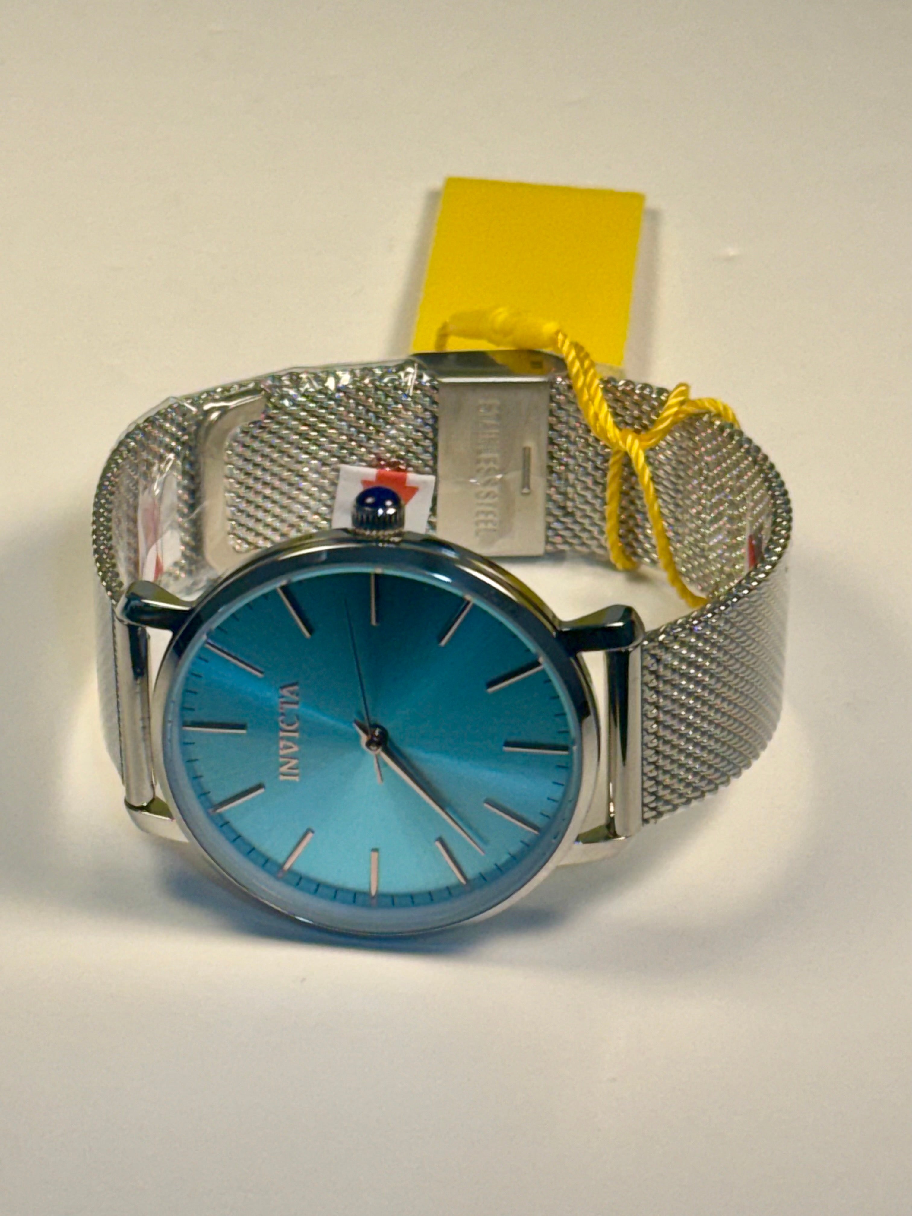 Invicta Angel Starlight  Silver watch with blue face and yellow strap on a white background