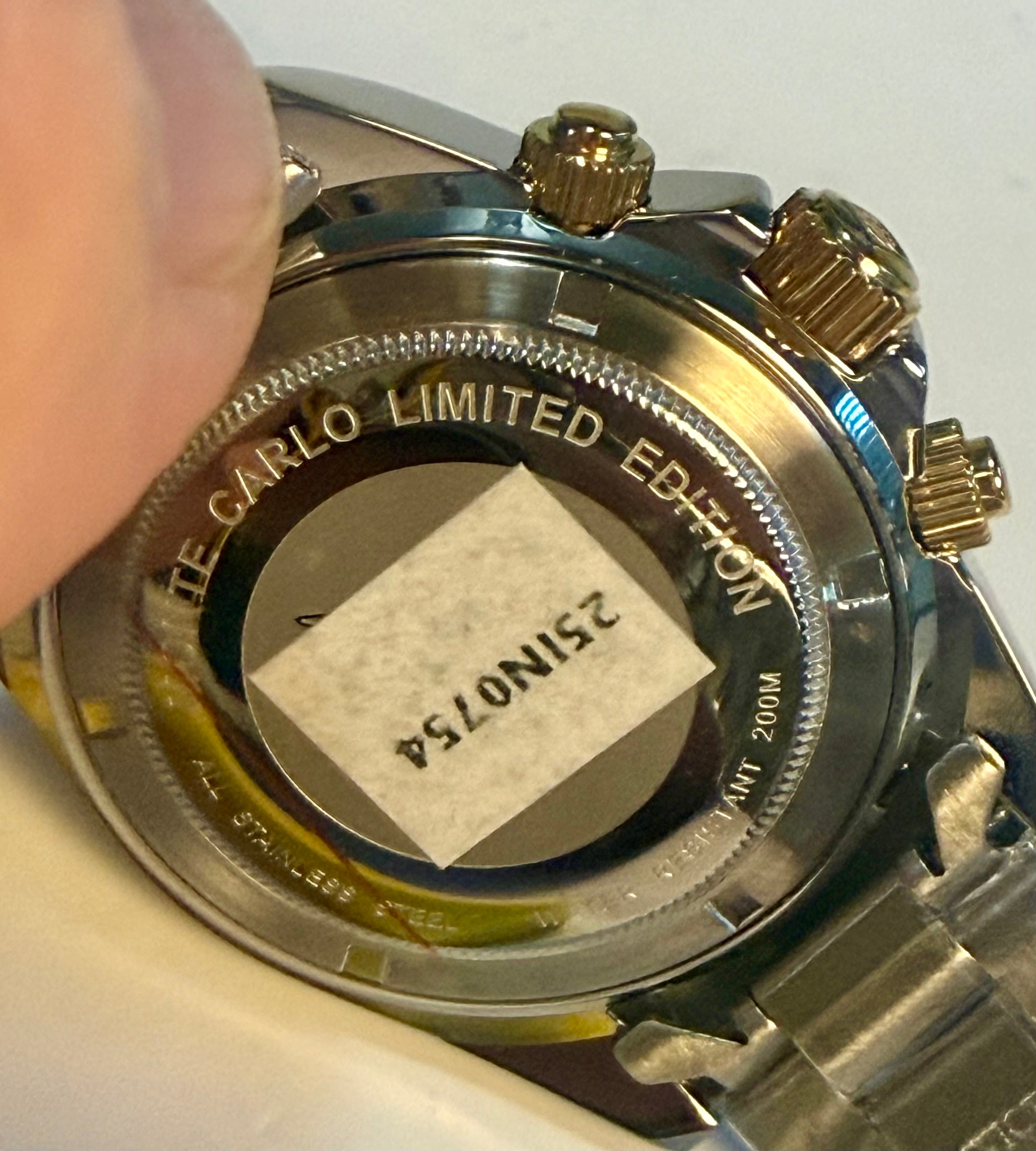 Close-up of a Invicta Speedway Monte Carlowatch case with 'Monte Carlo Limited Edition' engraving and a visible serial number.