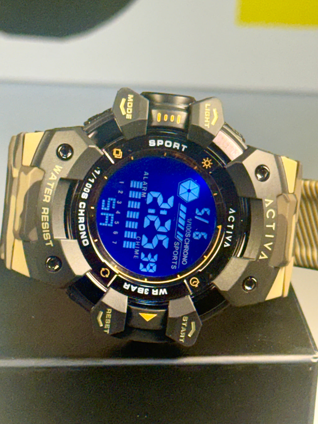 Activa Camo Sport Watch Digital sports watch with blue screen on a black surface