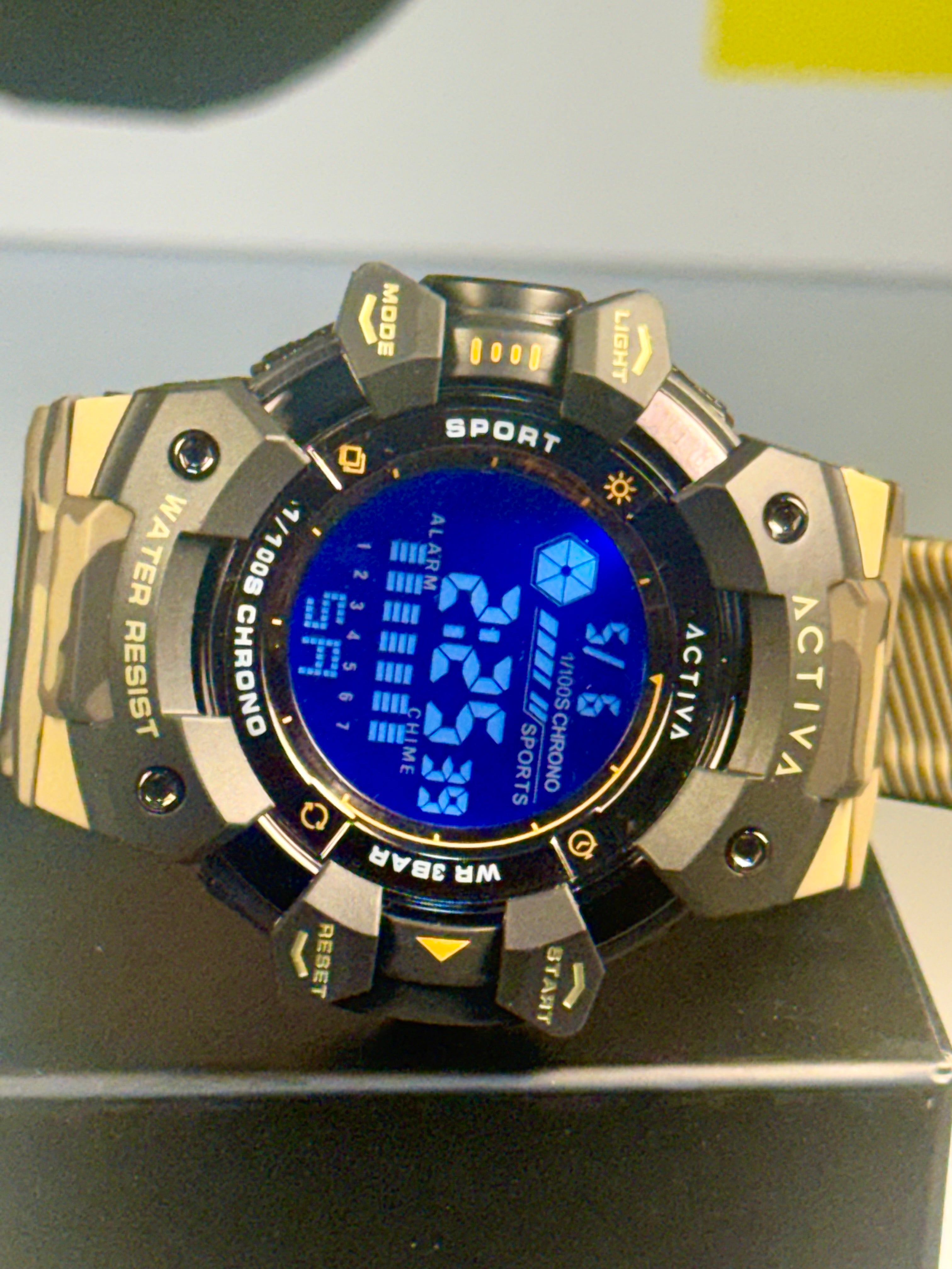 Activa Camo Sport Watch Digital sports watch with blue screen on a black surface