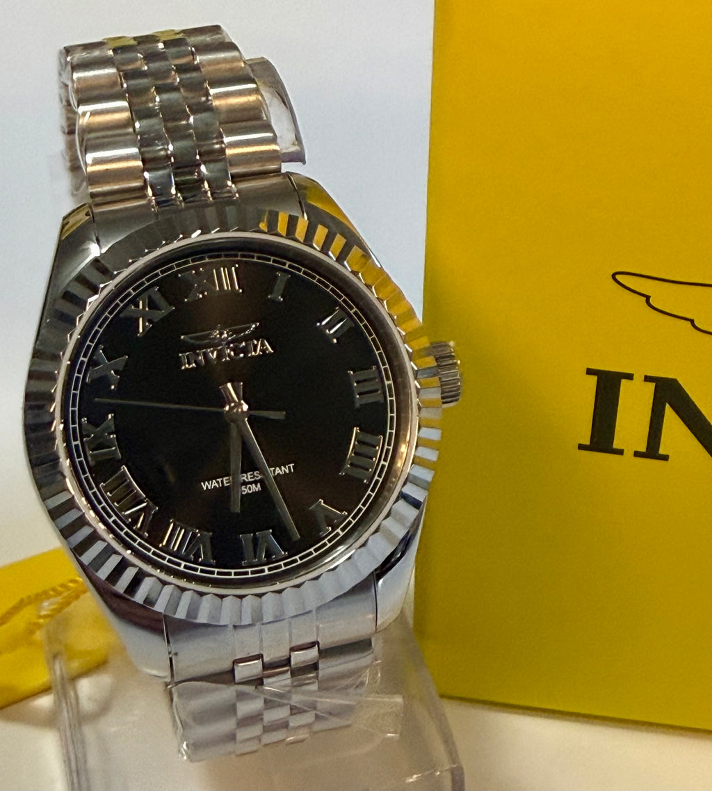 Ladies Specialty Windsor 36mm Silver watch with black face on a clear stand against a yellow background