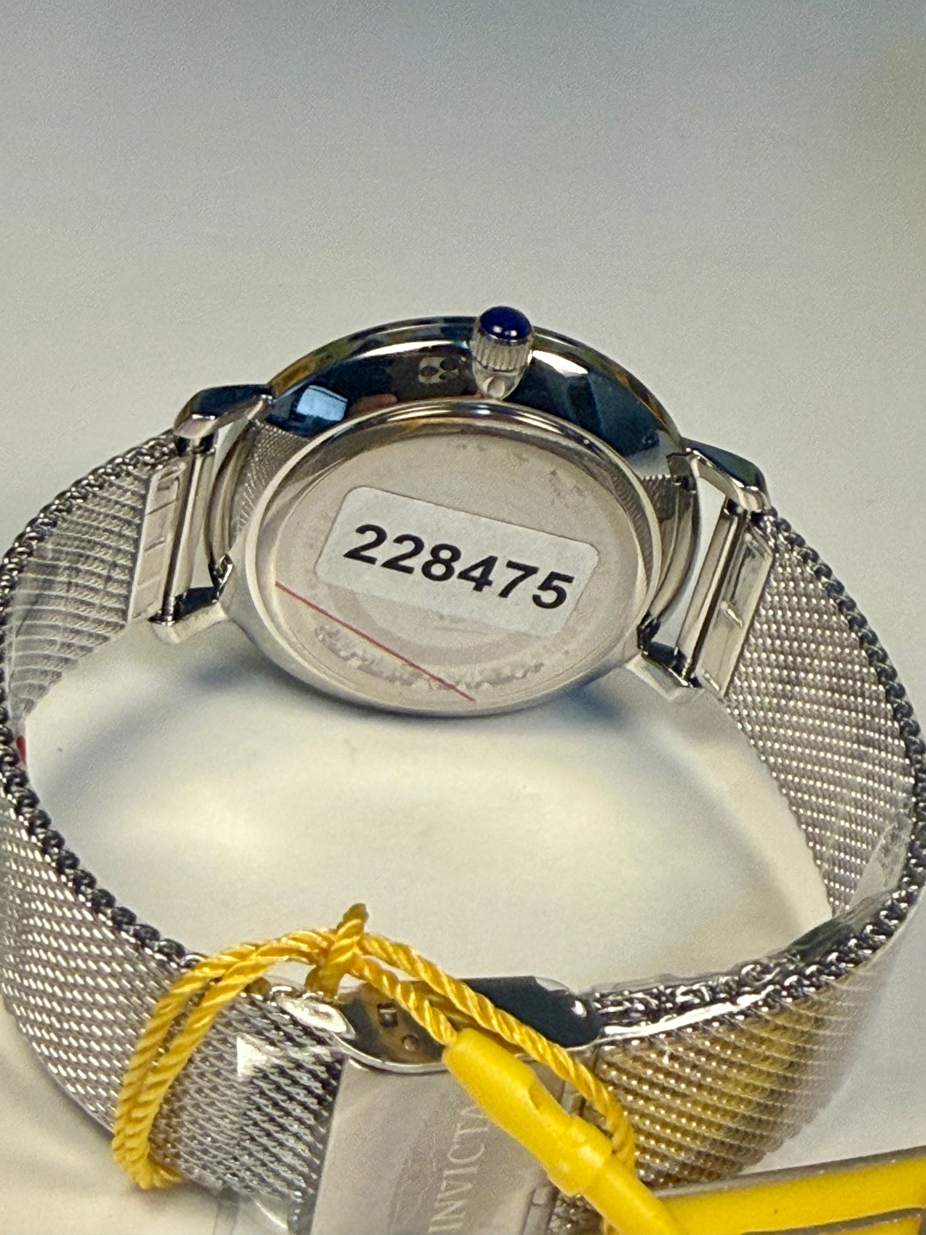 Invicta Angel Starlight  watch with a visible serial number on a light gray background