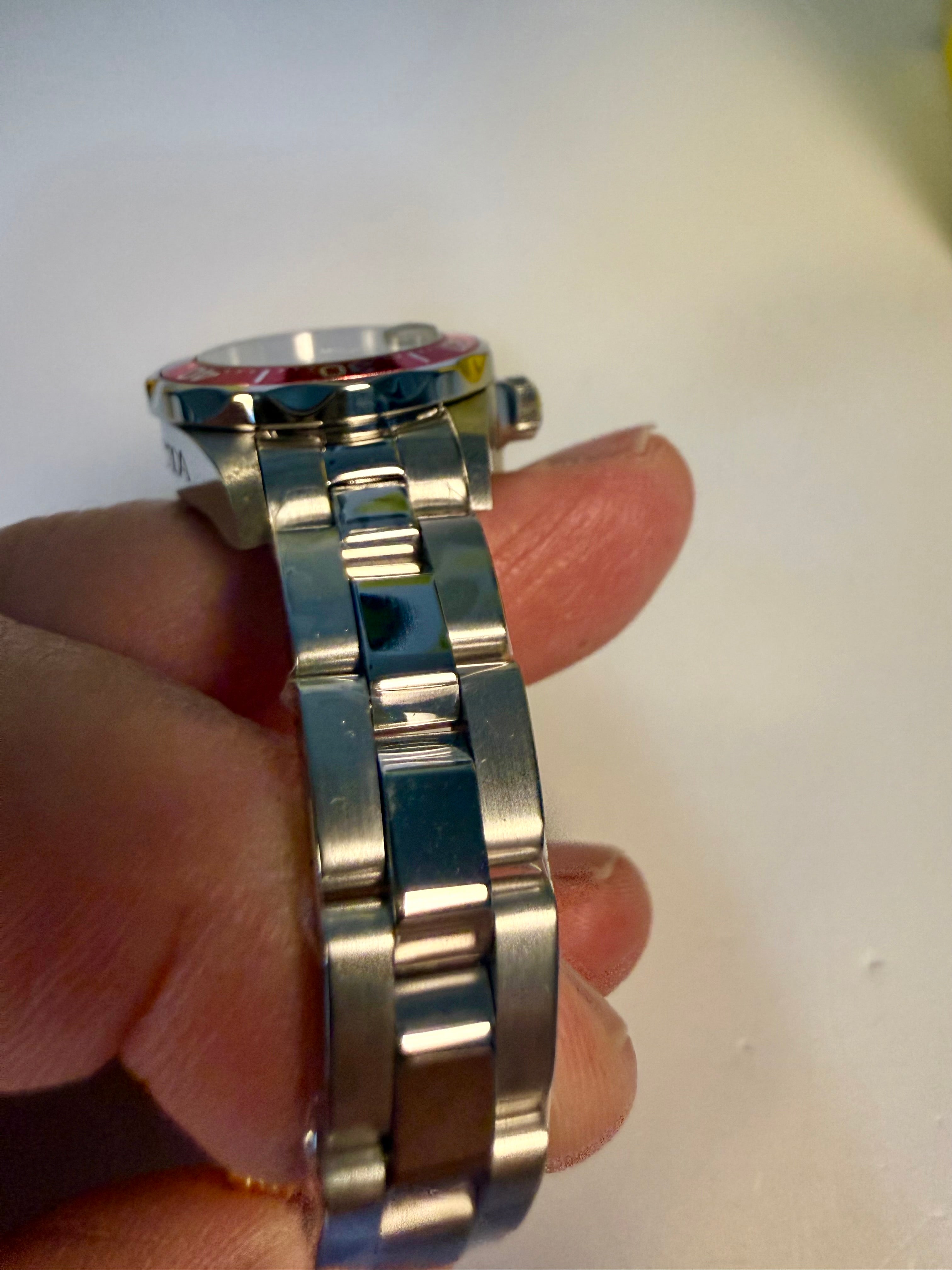 Ladies Pro Diver  watch band held by a hand against a neutral background
