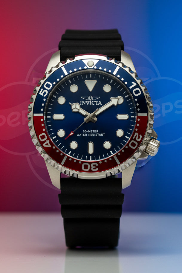 Invicta Mens Pro Diver 48mm Silicone band Wristwatch with black strap and blue and red bezel on a white background