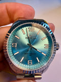Invicta Specialty Stratford watch with blue gradient dial held in a hand