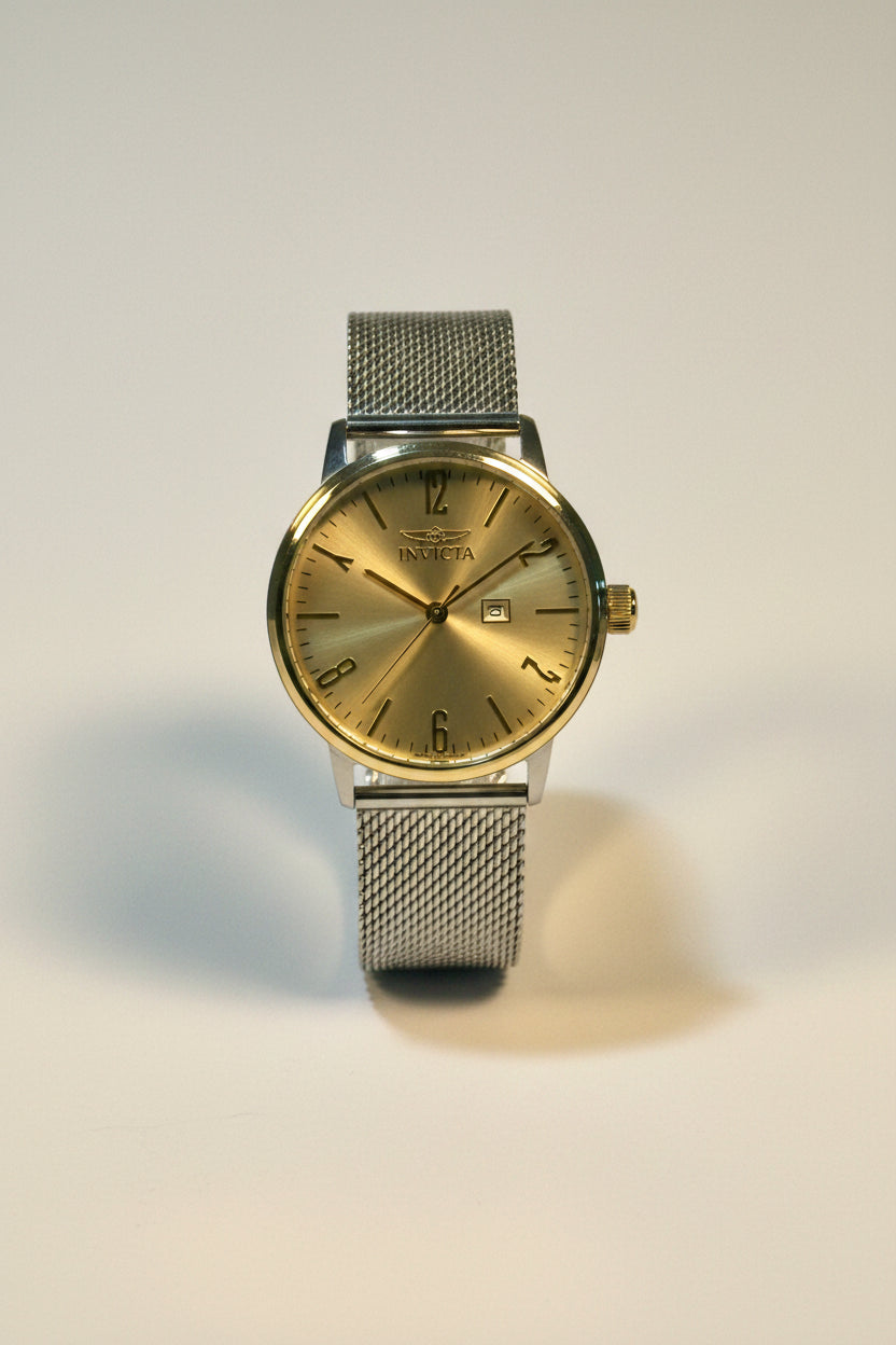 Invicta Mens Specialty Silver watch with a mesh band on a light gray background