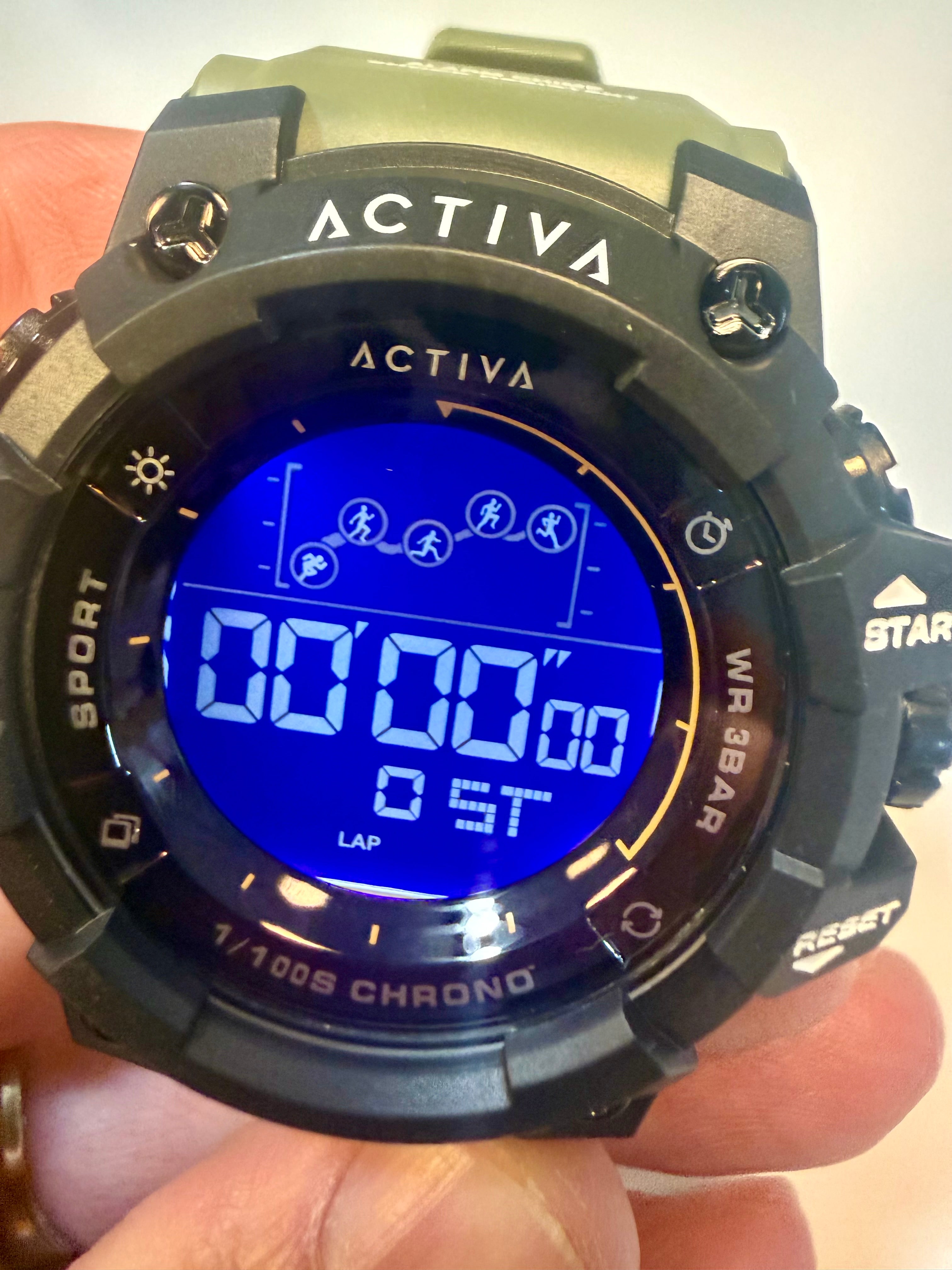 Activa X by Invicta Digital watch with blue screen held by a hand, brand 'Activa' visible