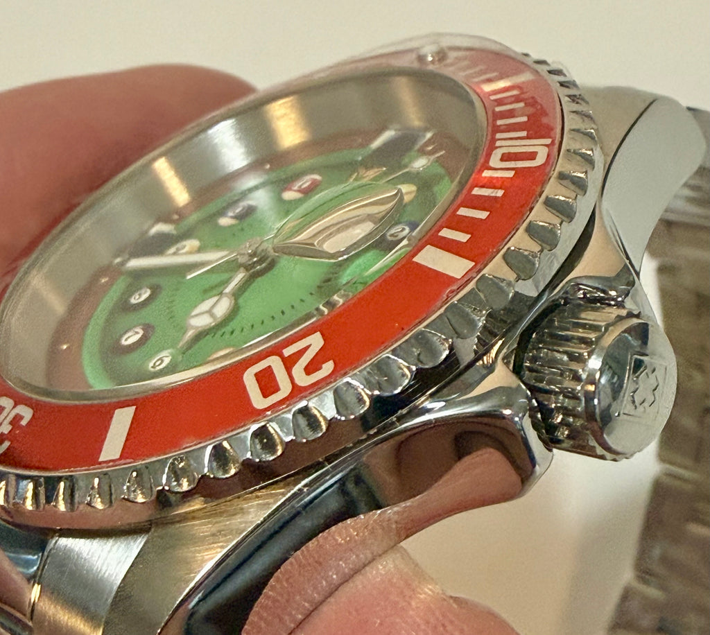 Close-up of a Invicta Pro Diver House of Cards Men's Watch - 40mm. held by a hand.