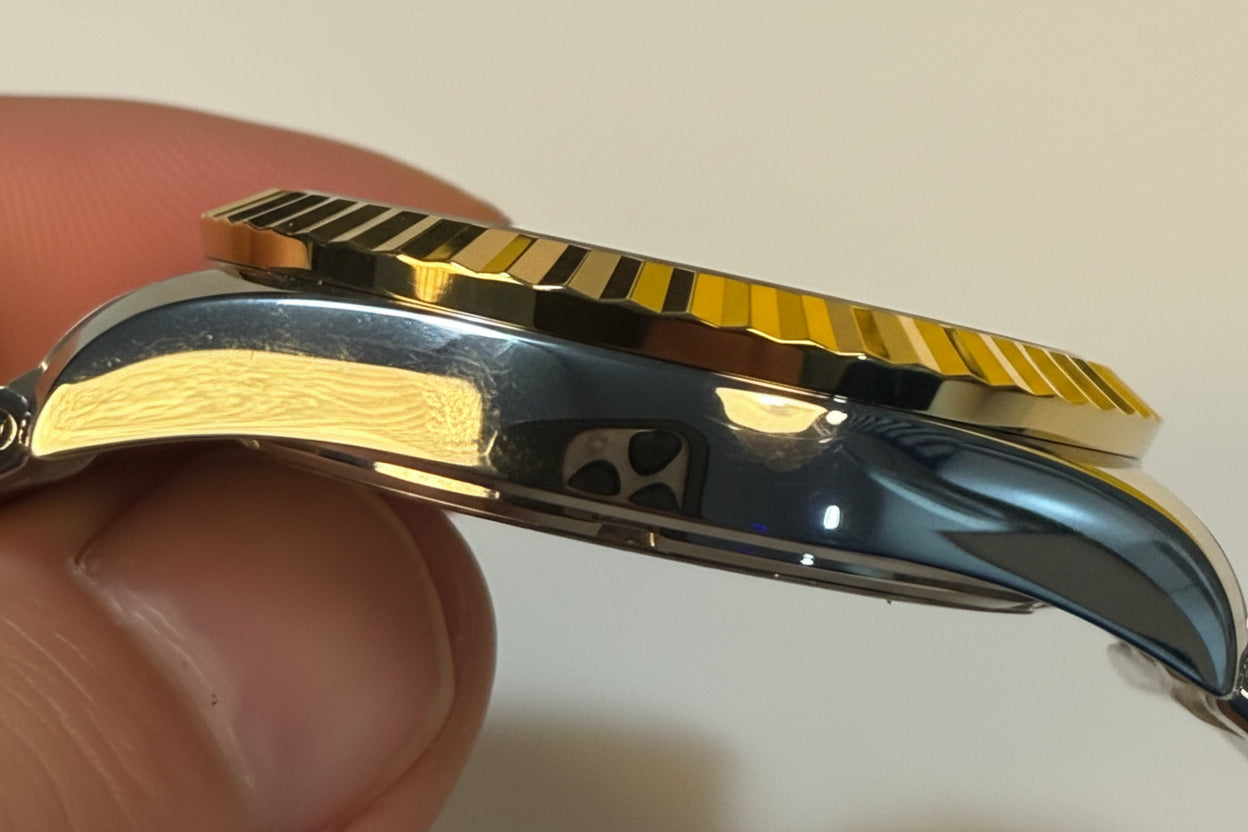 Close-up of a Invicta Mens Specialty Belmont 43mm accents held by a hand.