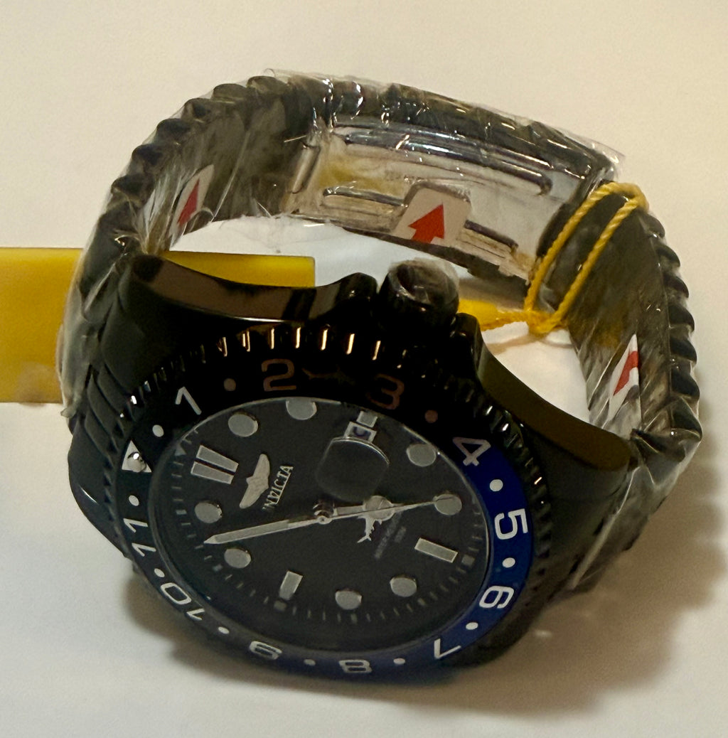 Invicta watch with a textured band on a white surface