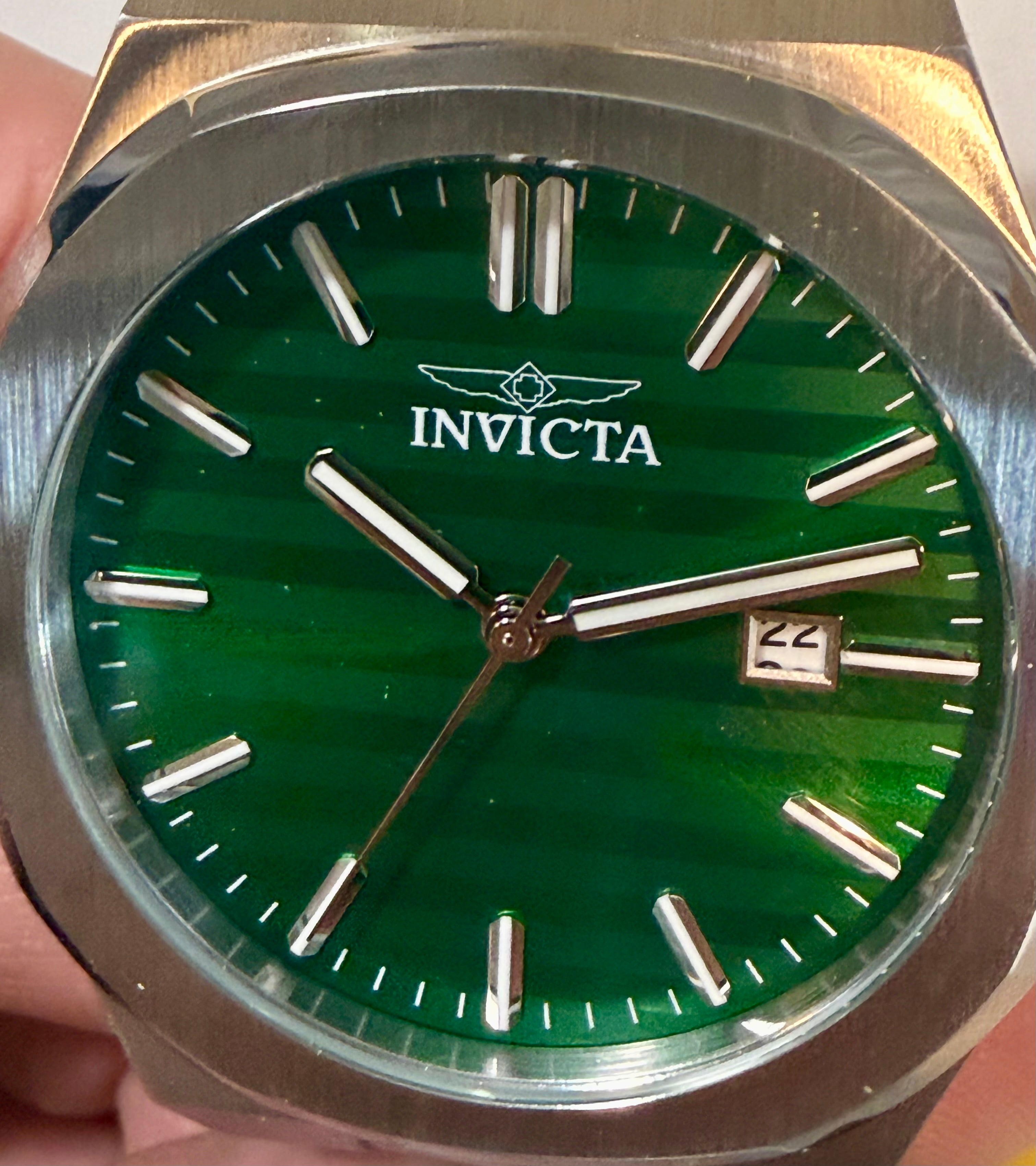 Invicta Speedway Vantage Men's Watch - 43mm. Steel watch with green face and silver case held by a hand