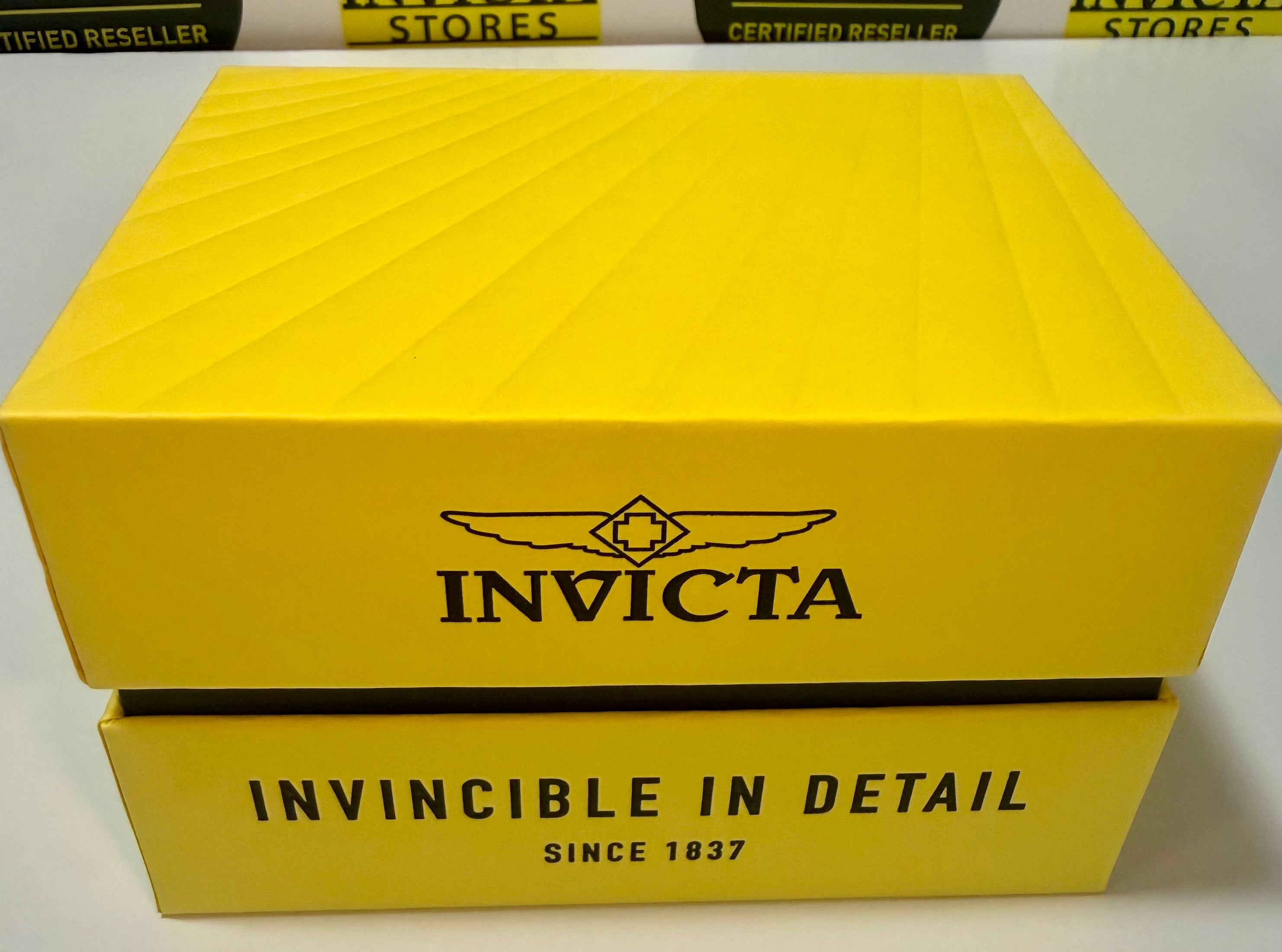 Yellow Invicta box with brand logo and text on a white background
