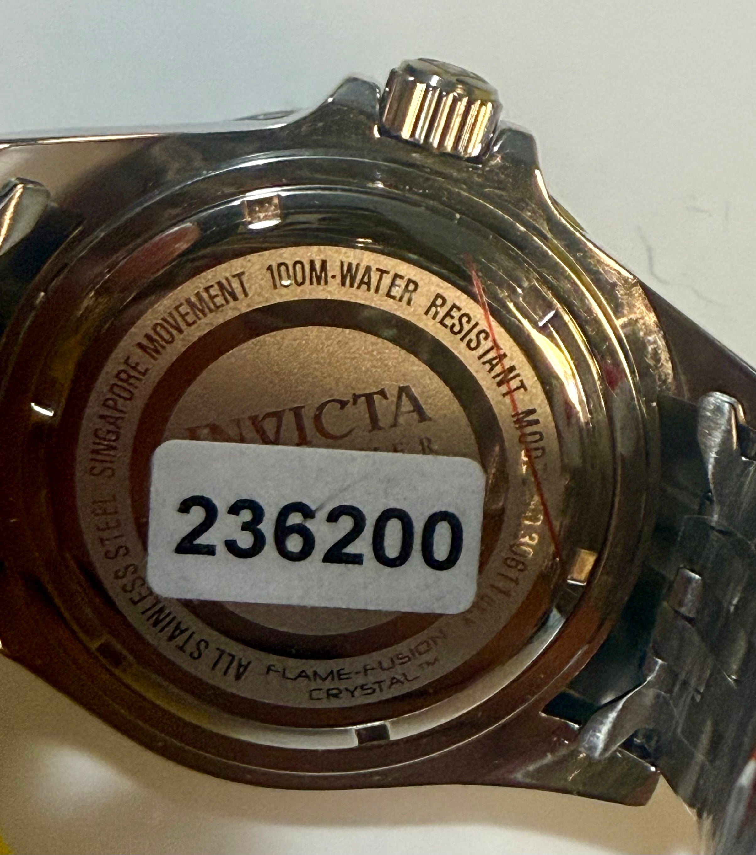 Invicta Mens Pro Diver 43mm Back of a watch with brand name and model number on a white background