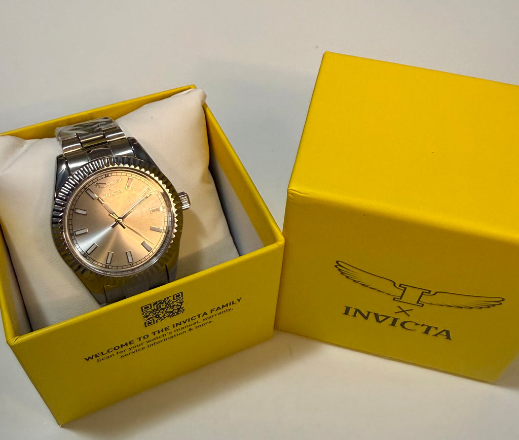 Silver Invicta Mens Specialty I 40mm watch in a yellow Invicta box on a white background