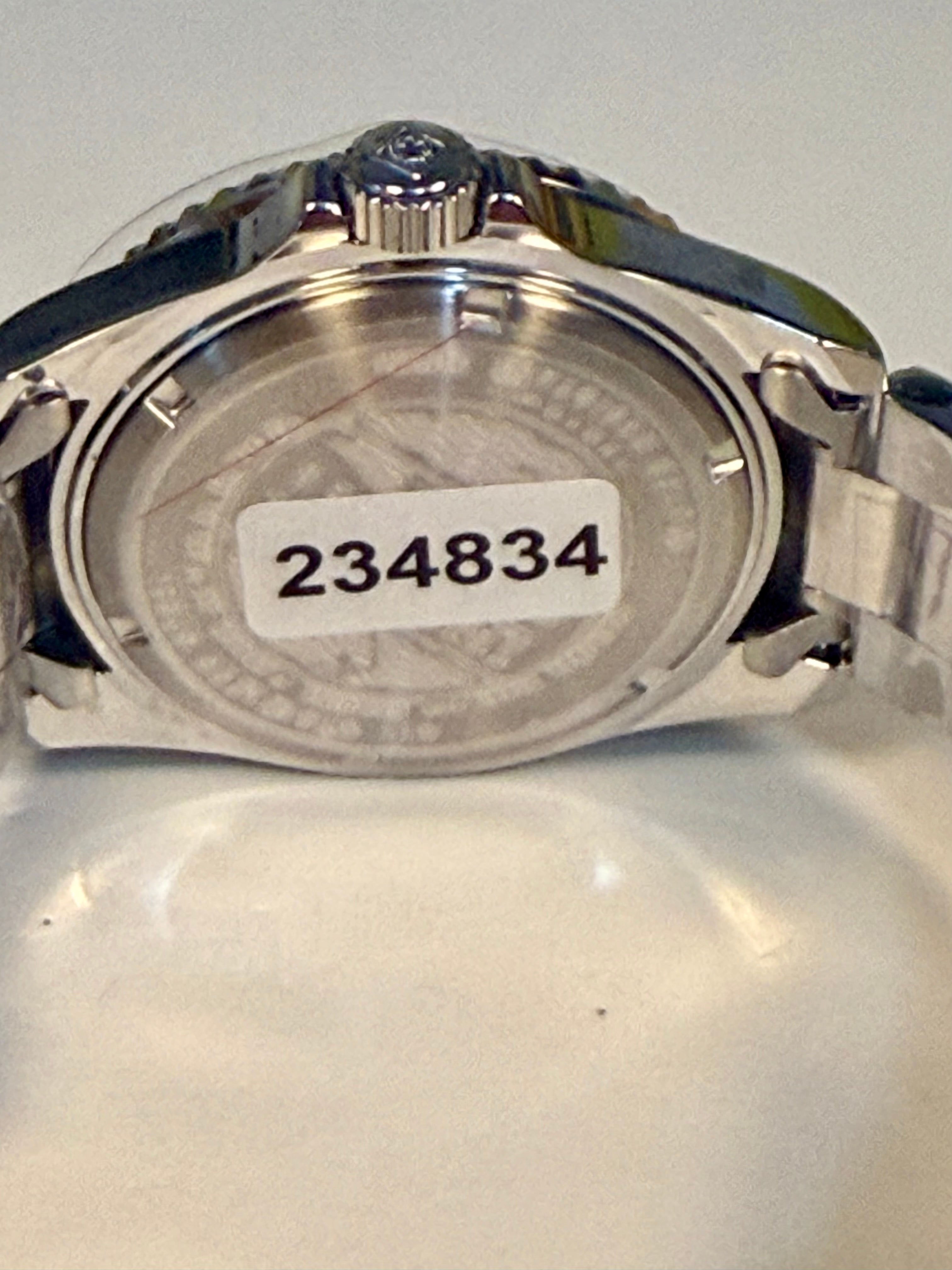 Invicta Pro Diver 12819 Swiss Ronda 515 40mm 0.06ctw Diamond Back view of a silver watch with a visible serial number on a light gray background